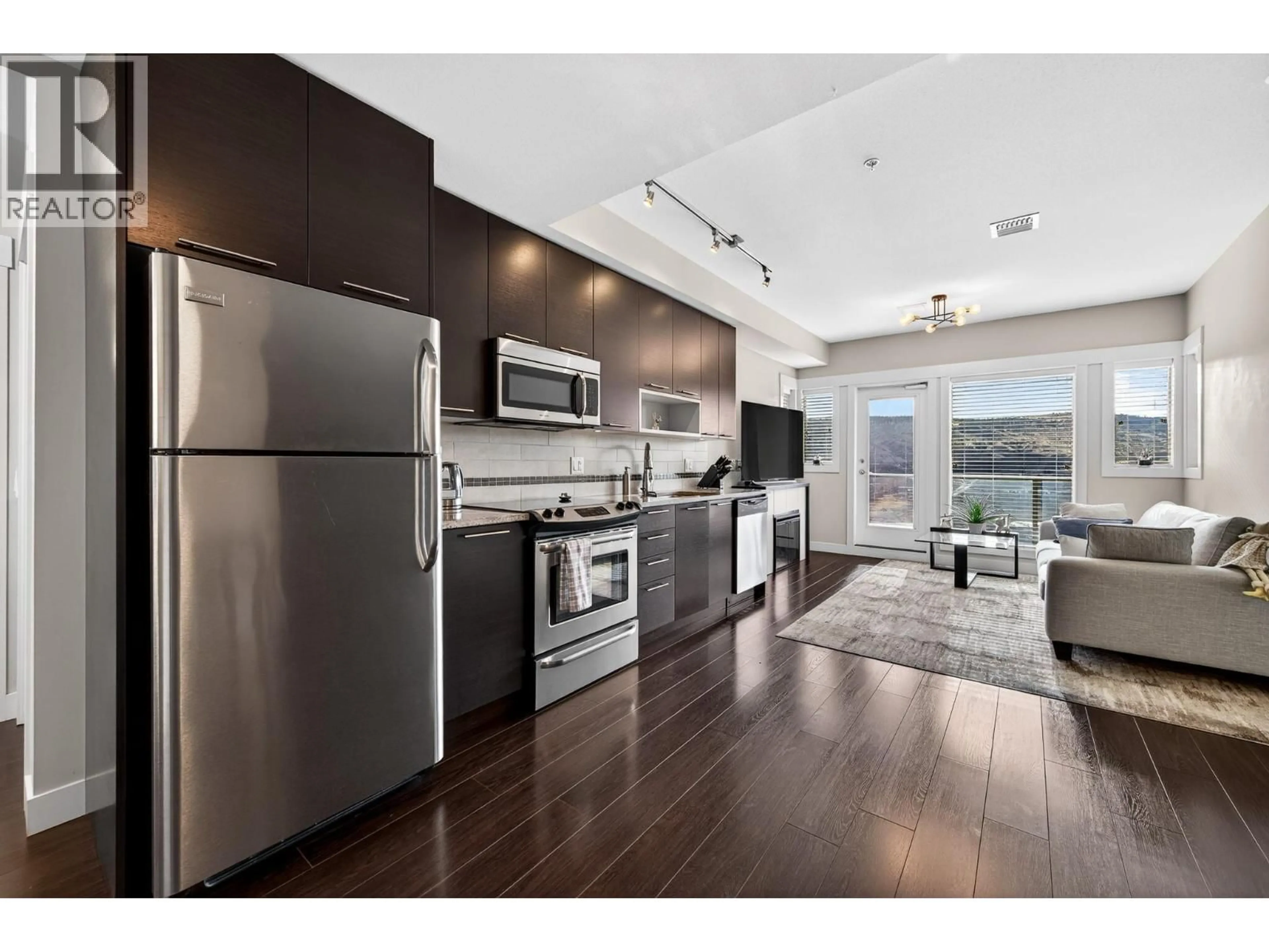 Open concept kitchen, wood/laminate floor for 3212 - 1040 TALASA COURT, Kamloops British Columbia V2H0C4