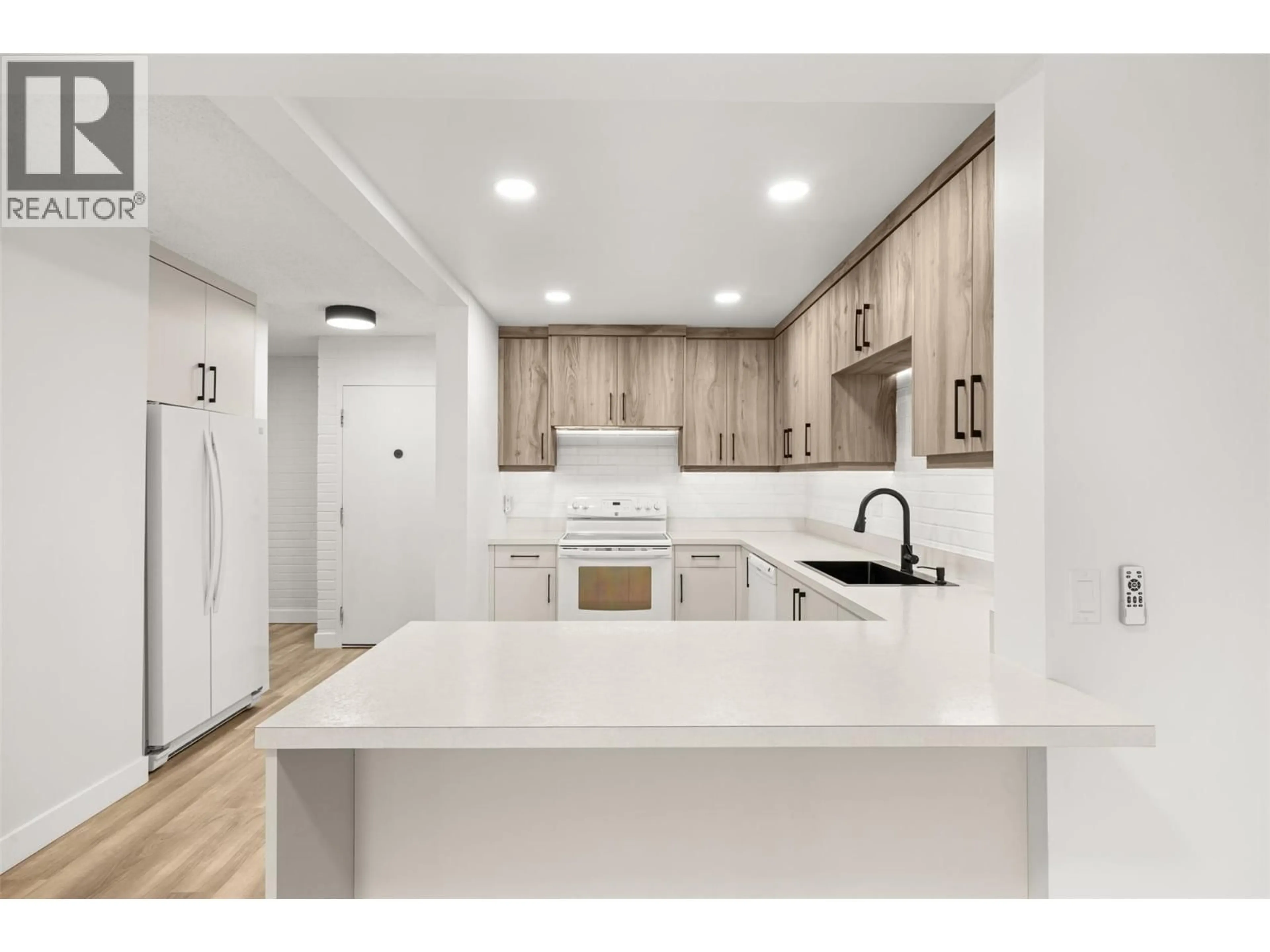 Open concept kitchen, ceramic/tile floor for 104 - 1915 PACIFIC COURT, Kelowna British Columbia V1Y8B3