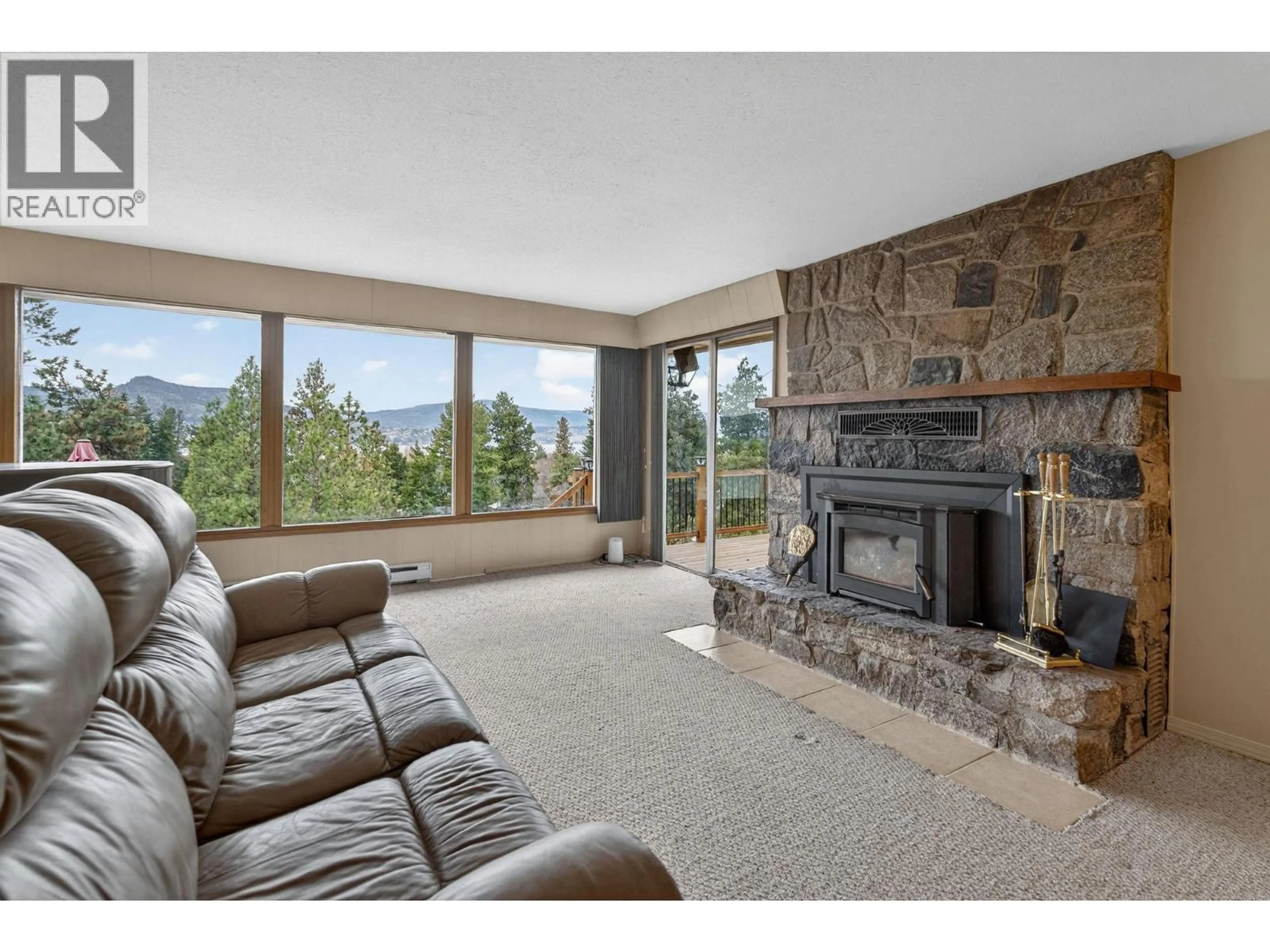 Living room with furniture, unknown for 3305 MCGIBNEY ROAD, Naramata British Columbia V0H1N0