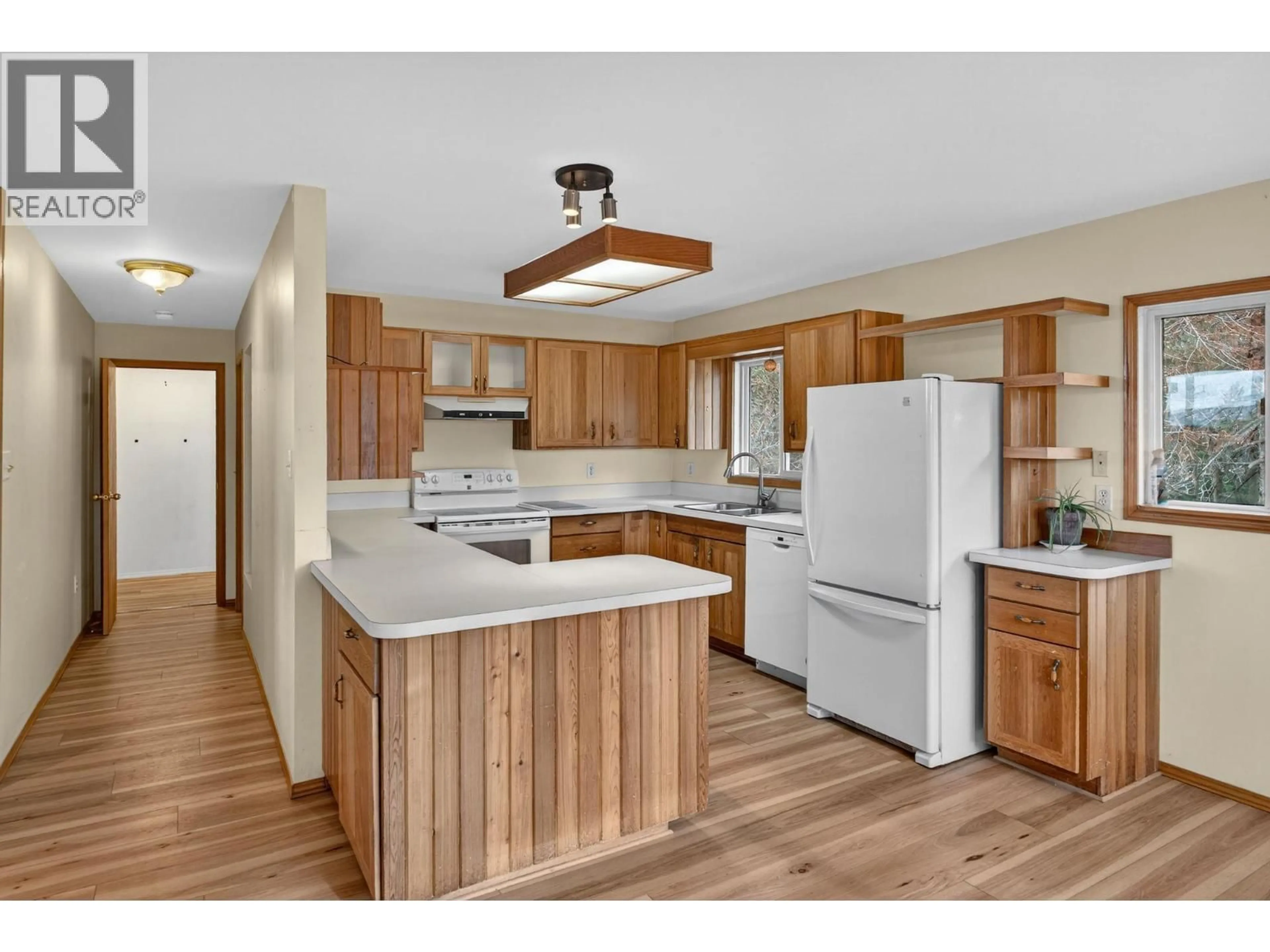 Open concept kitchen, wood/laminate floor for 3305 MCGIBNEY ROAD, Naramata British Columbia V0H1N0