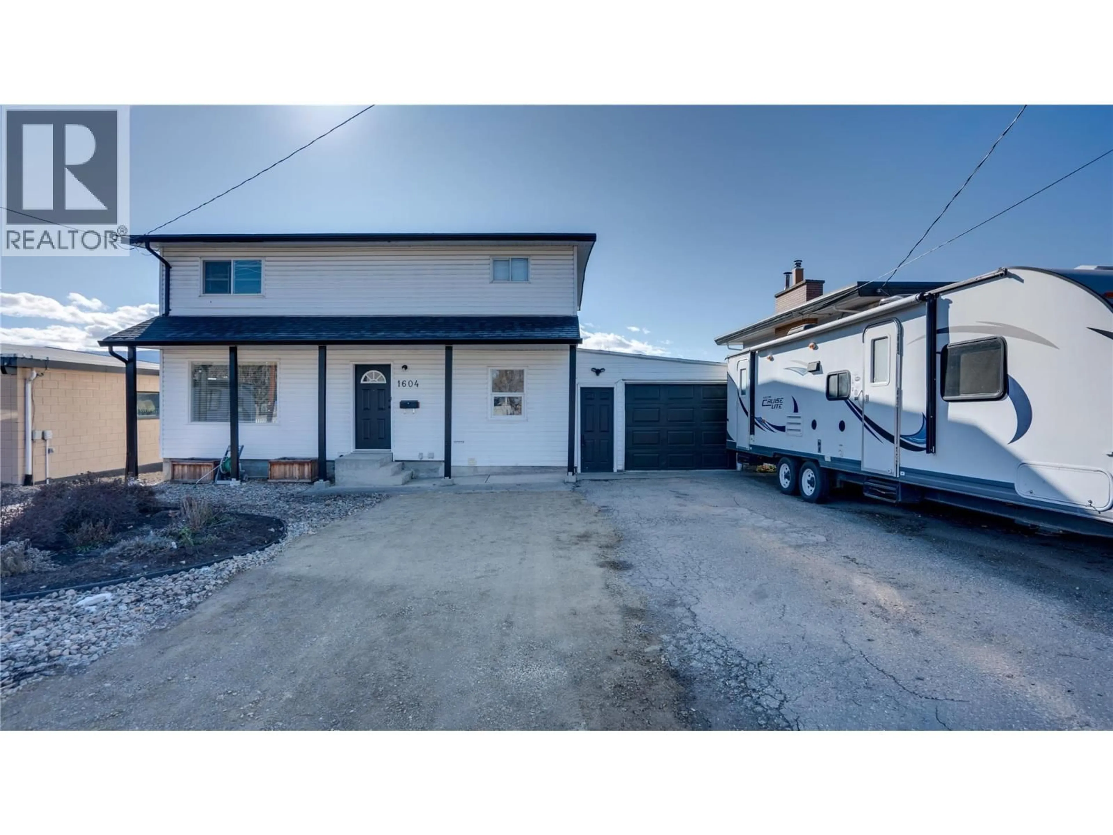 A pic from outside/outdoor area/front of a property/back of a property/a pic from drone, street for 1604 25 AVENUE, Vernon British Columbia V1T1M7