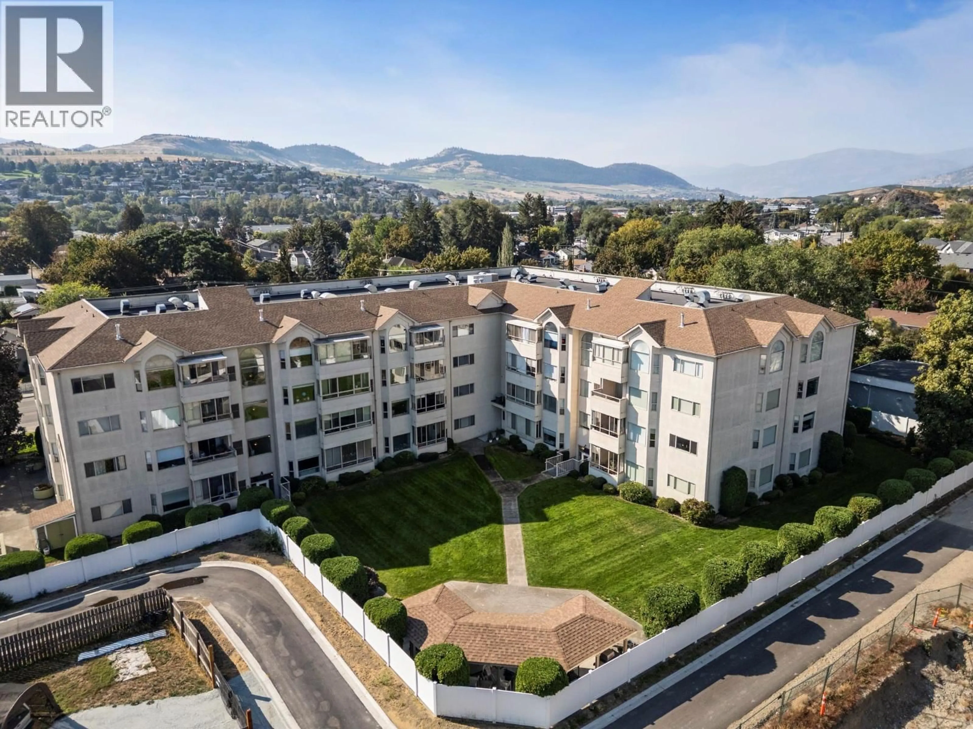 A pic from outside/outdoor area/front of a property/back of a property/a pic from drone, mountain view for 304 - 3805 30 AVENUE, Vernon British Columbia V1T9M3