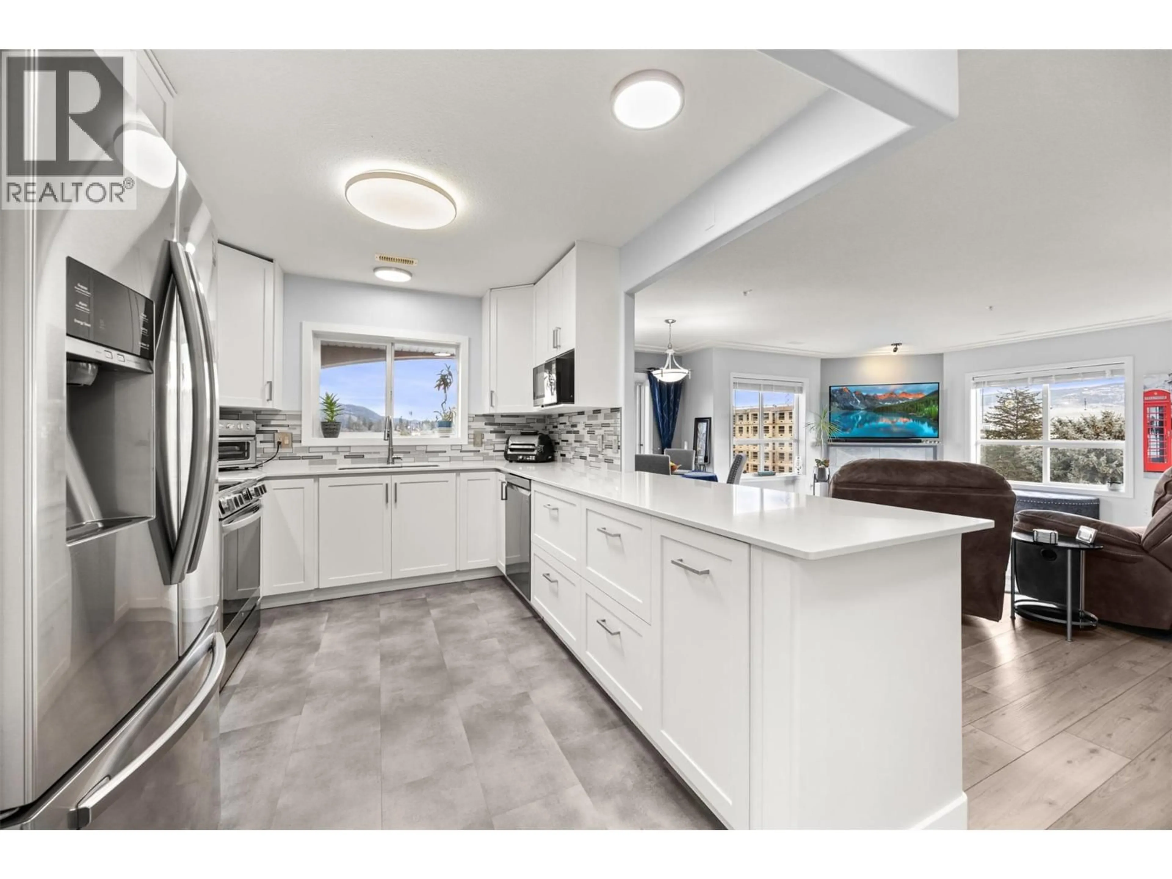 Open concept kitchen, ceramic/tile floor for 502 - 1895 AMBROSI ROAD, Kelowna British Columbia V1Y4R8