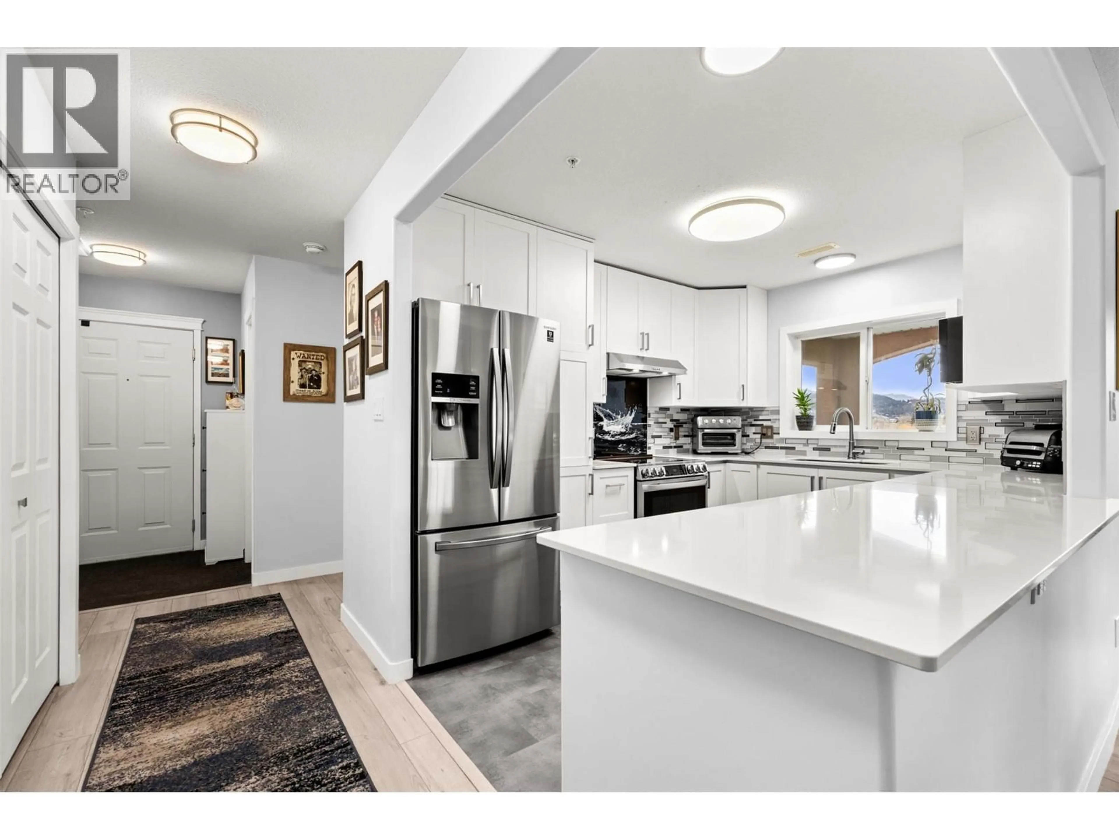 Open concept kitchen, unknown for 502 - 1895 AMBROSI ROAD, Kelowna British Columbia V1Y4R8