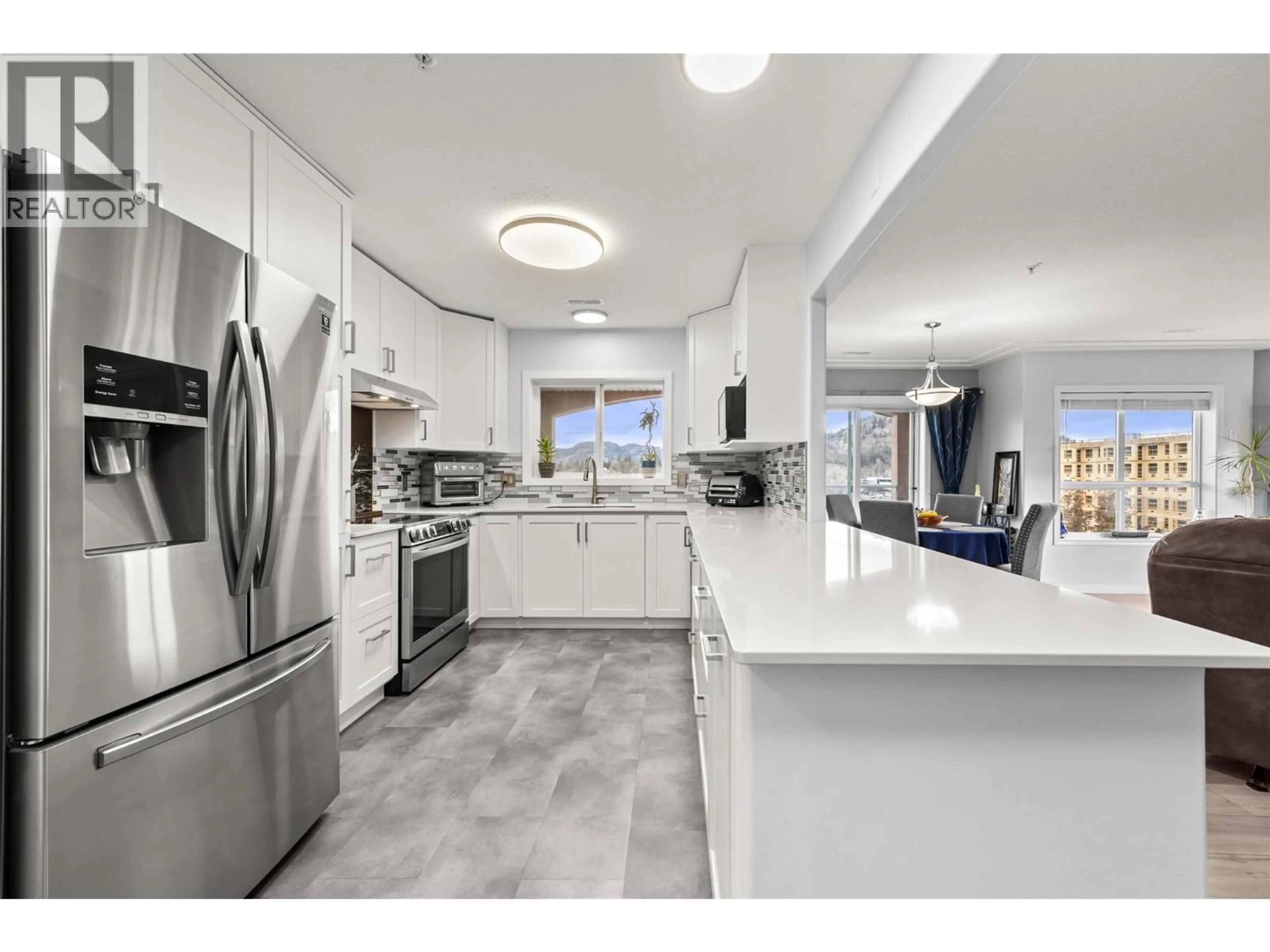 Open concept kitchen, ceramic/tile floor for 502 - 1895 AMBROSI ROAD, Kelowna British Columbia V1Y4R8