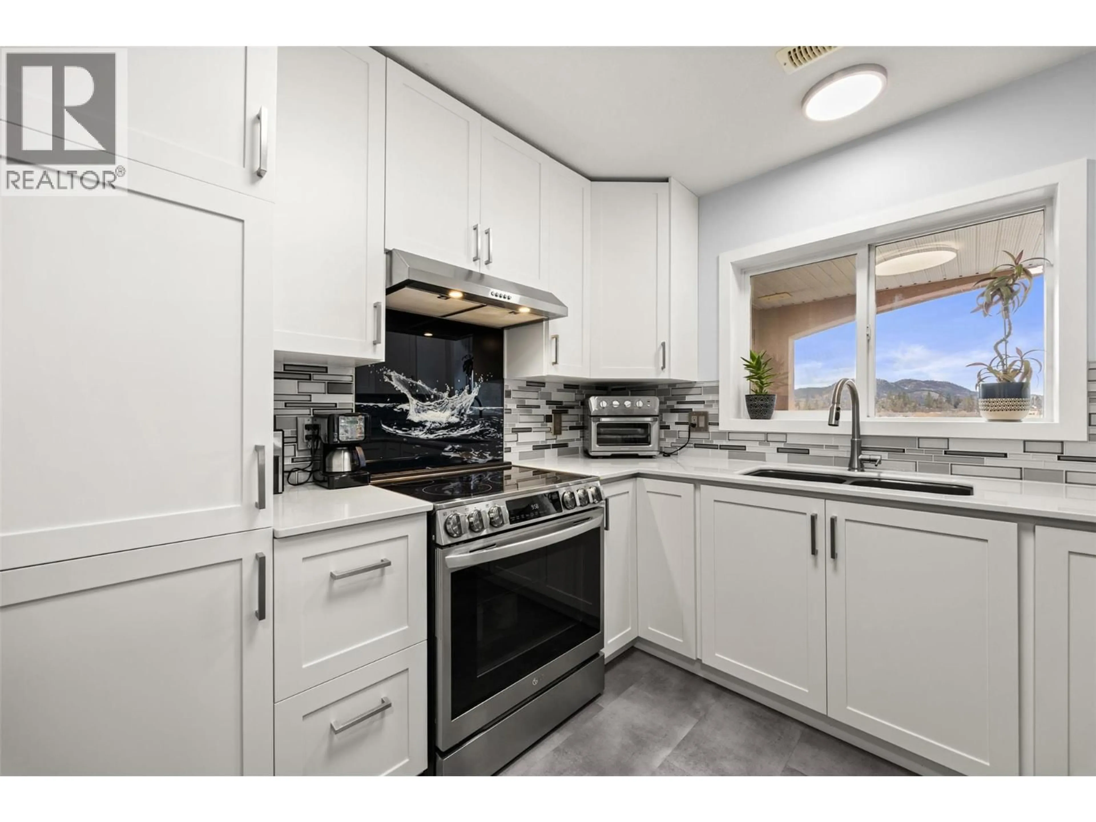 Standard kitchen, ceramic/tile floor for 502 - 1895 AMBROSI ROAD, Kelowna British Columbia V1Y4R8