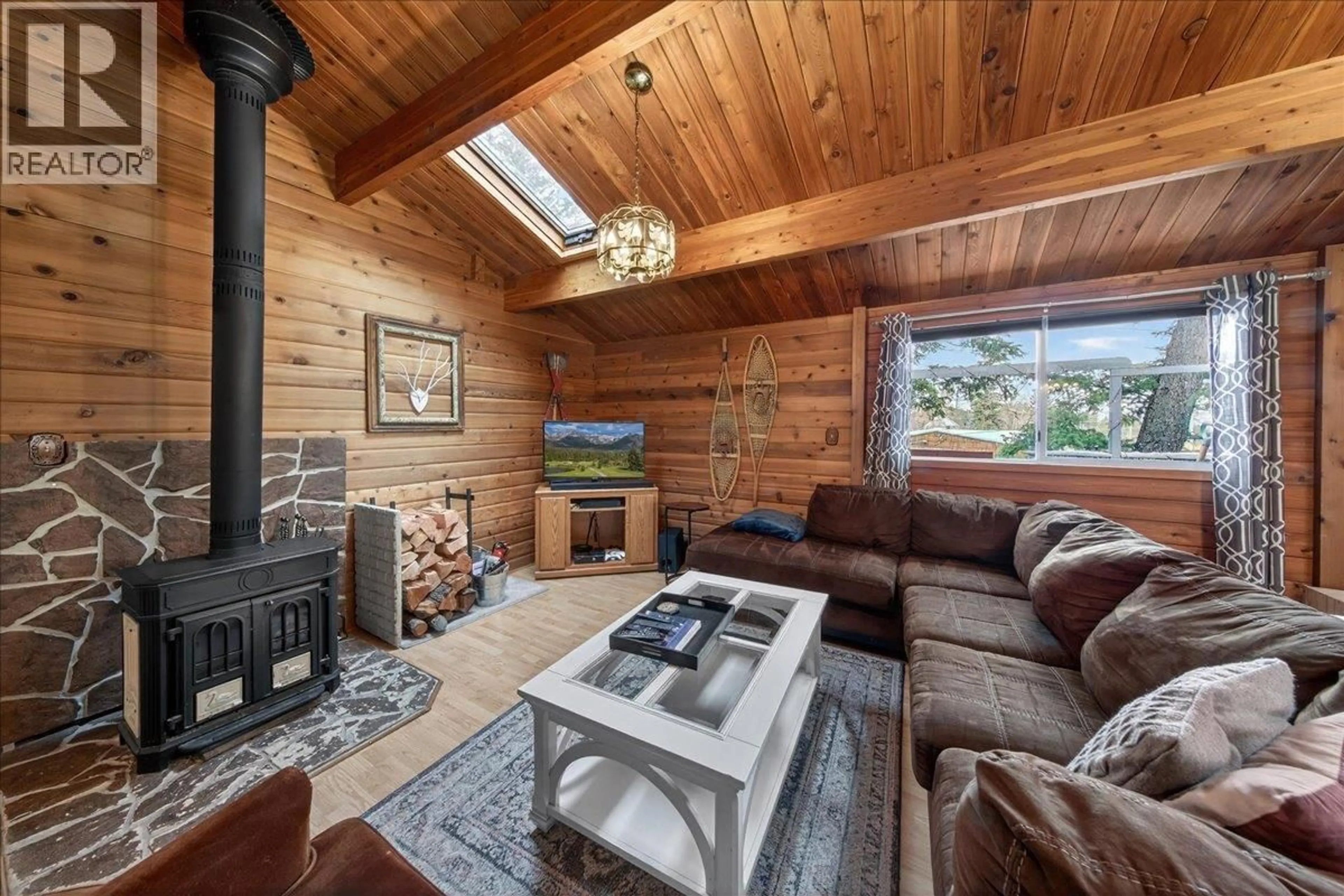 Living room with furniture, wood/laminate floor for 5024 HOT SPRINGS ROAD, Fairmont Hot Springs British Columbia V0B1L1