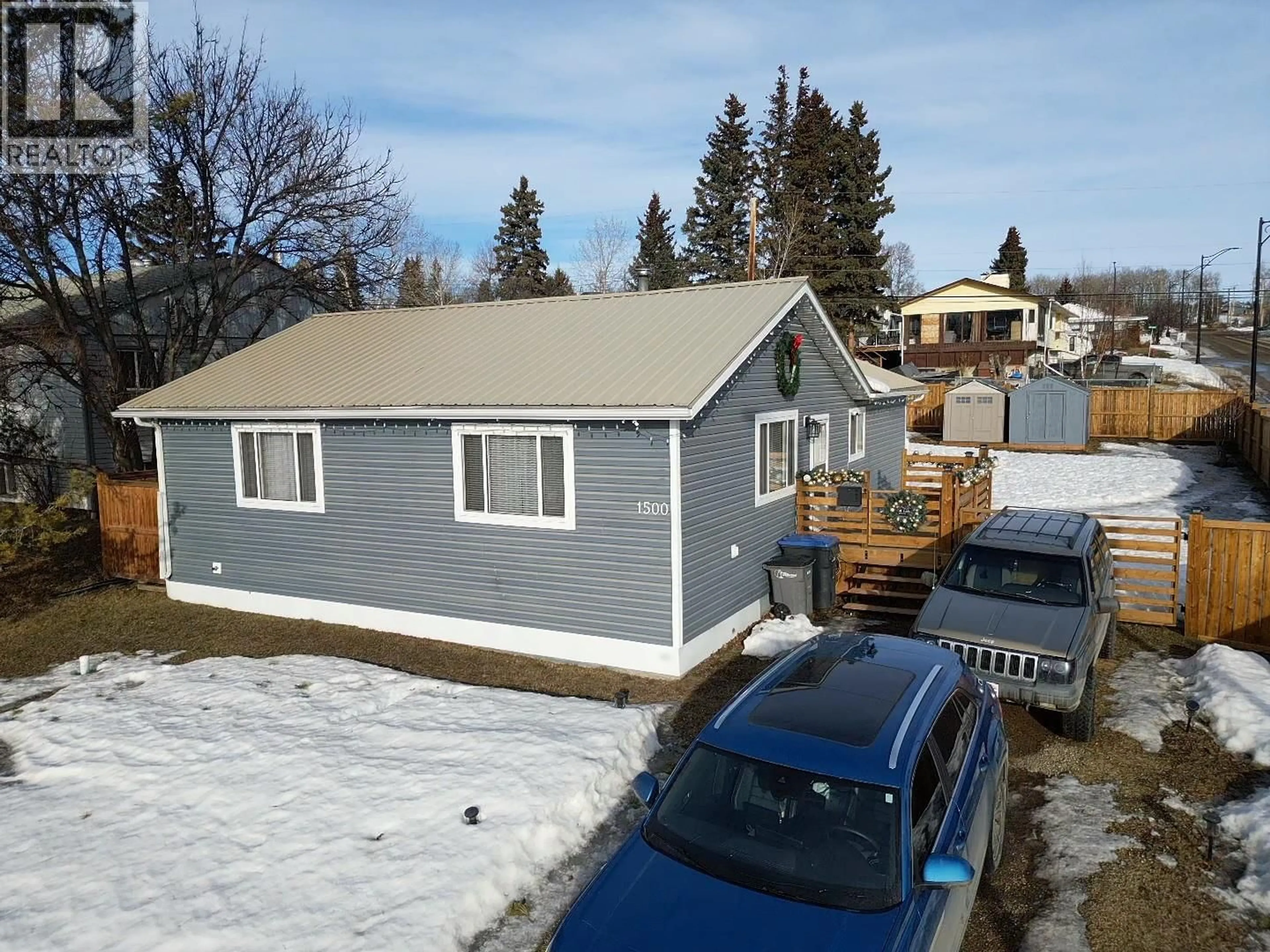 A pic from outside/outdoor area/front of a property/back of a property/a pic from drone, street for 1500 96 AVENUE, Dawson Creek British Columbia V1G1L6