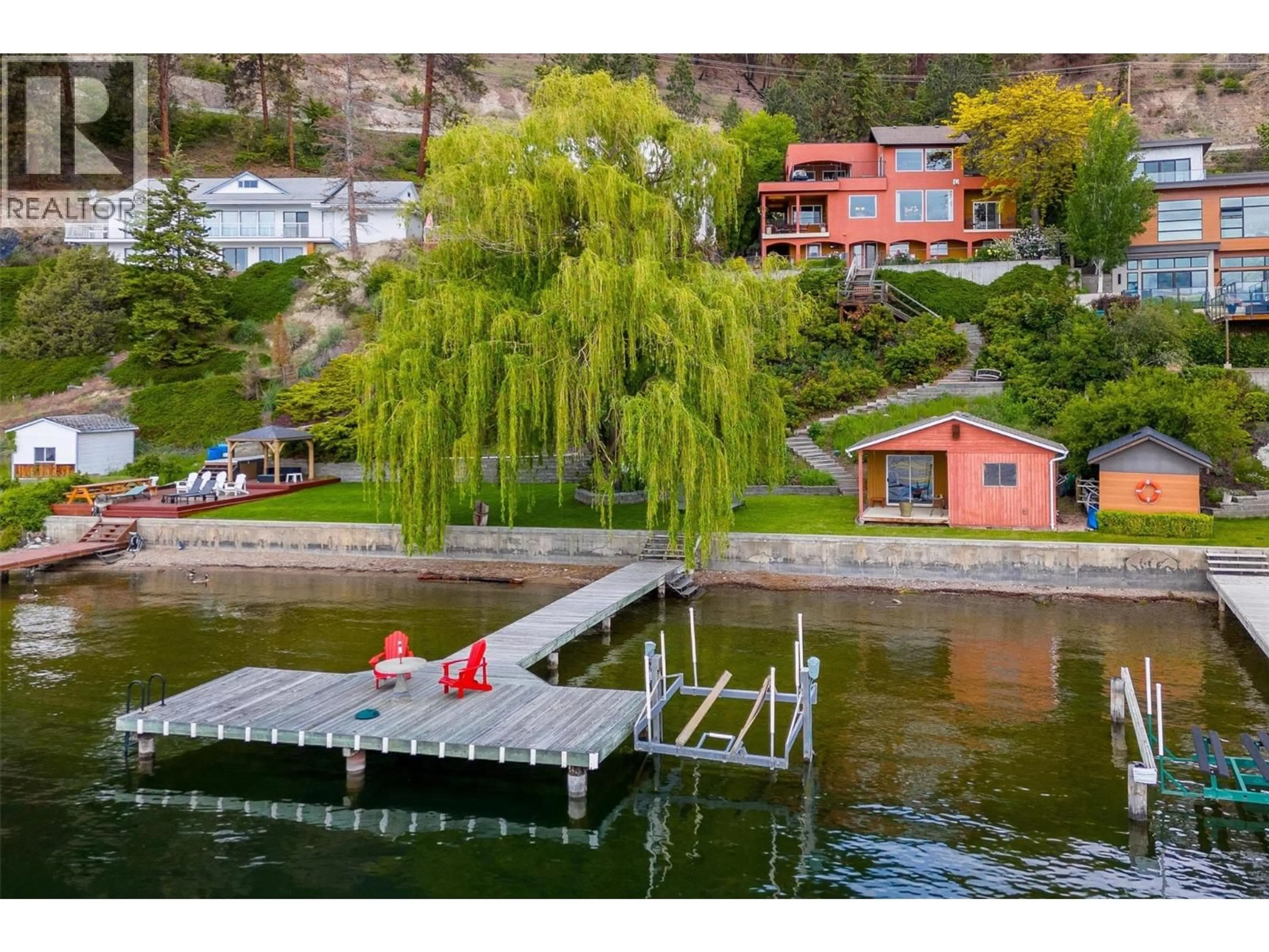 A pic from outside/outdoor area/front of a property/back of a property/a pic from drone, water/lake/river/ocean view for 683 WESTSIDE ROAD SOUTH, West Kelowna British Columbia V1Z3S2