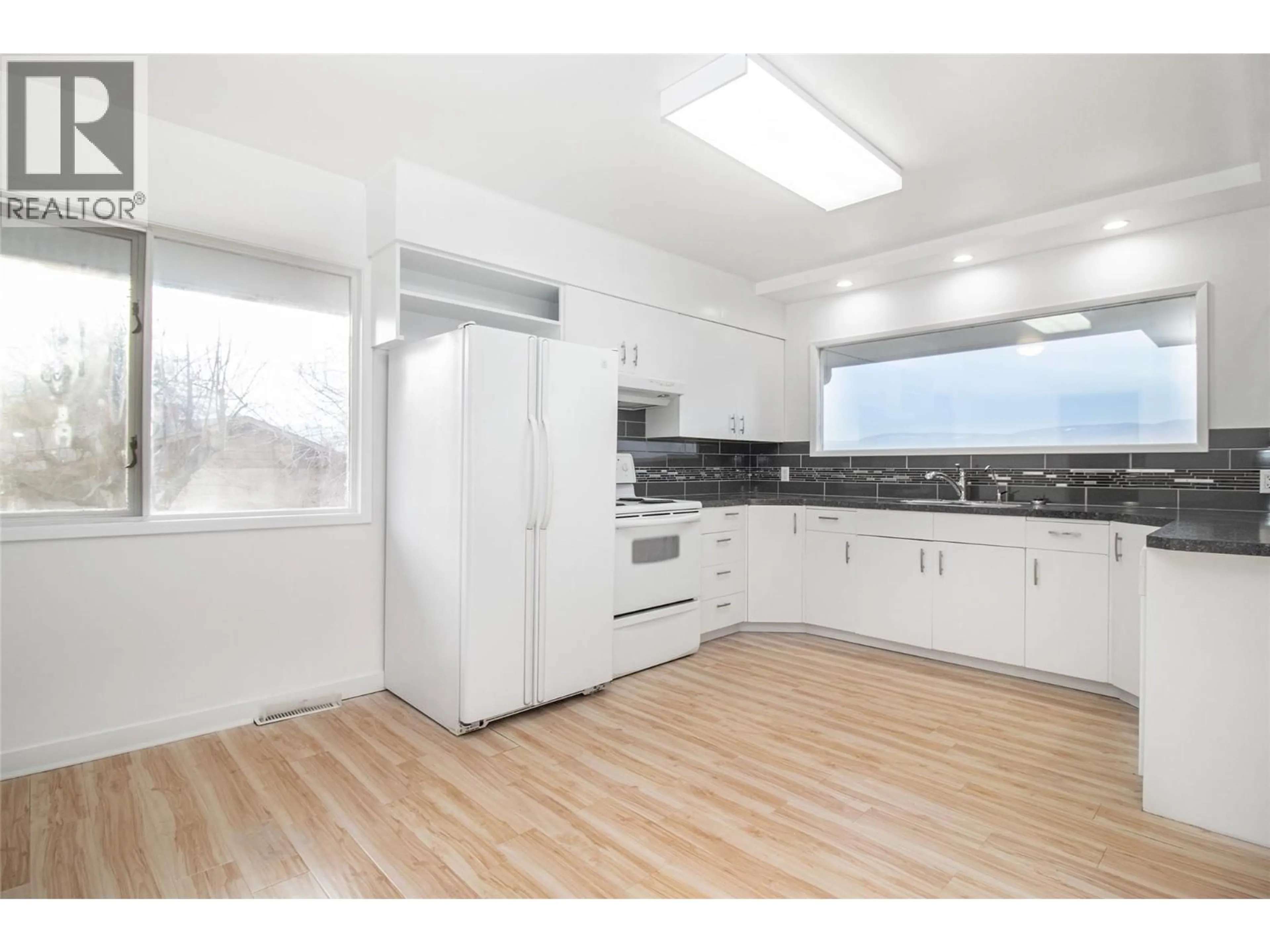 Standard kitchen, wood/laminate floor for 4829 LAKESHORE ROAD, Kelowna British Columbia V1W4H6