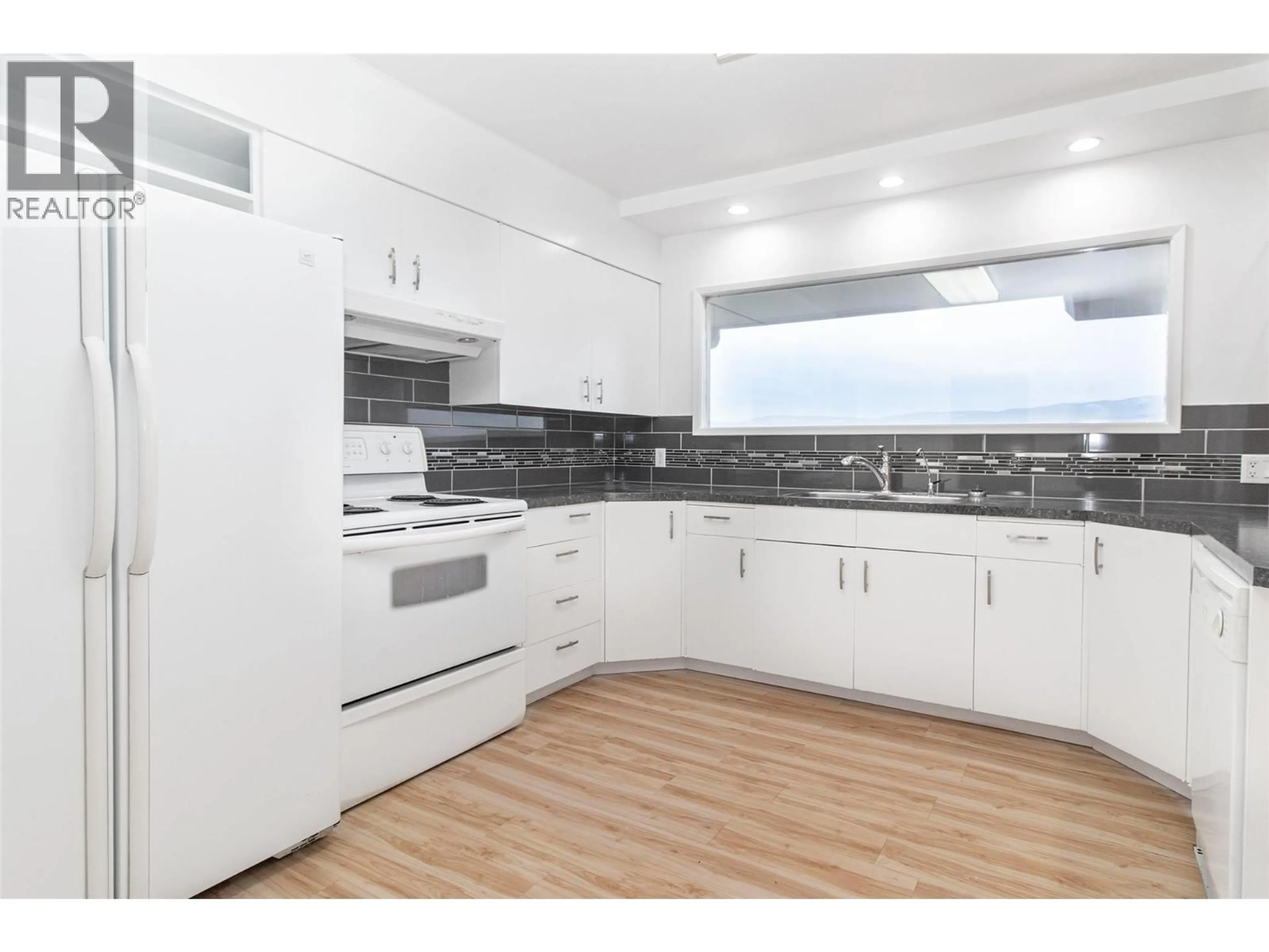 Standard kitchen, wood/laminate floor for 4829 LAKESHORE ROAD, Kelowna British Columbia V1W4H6