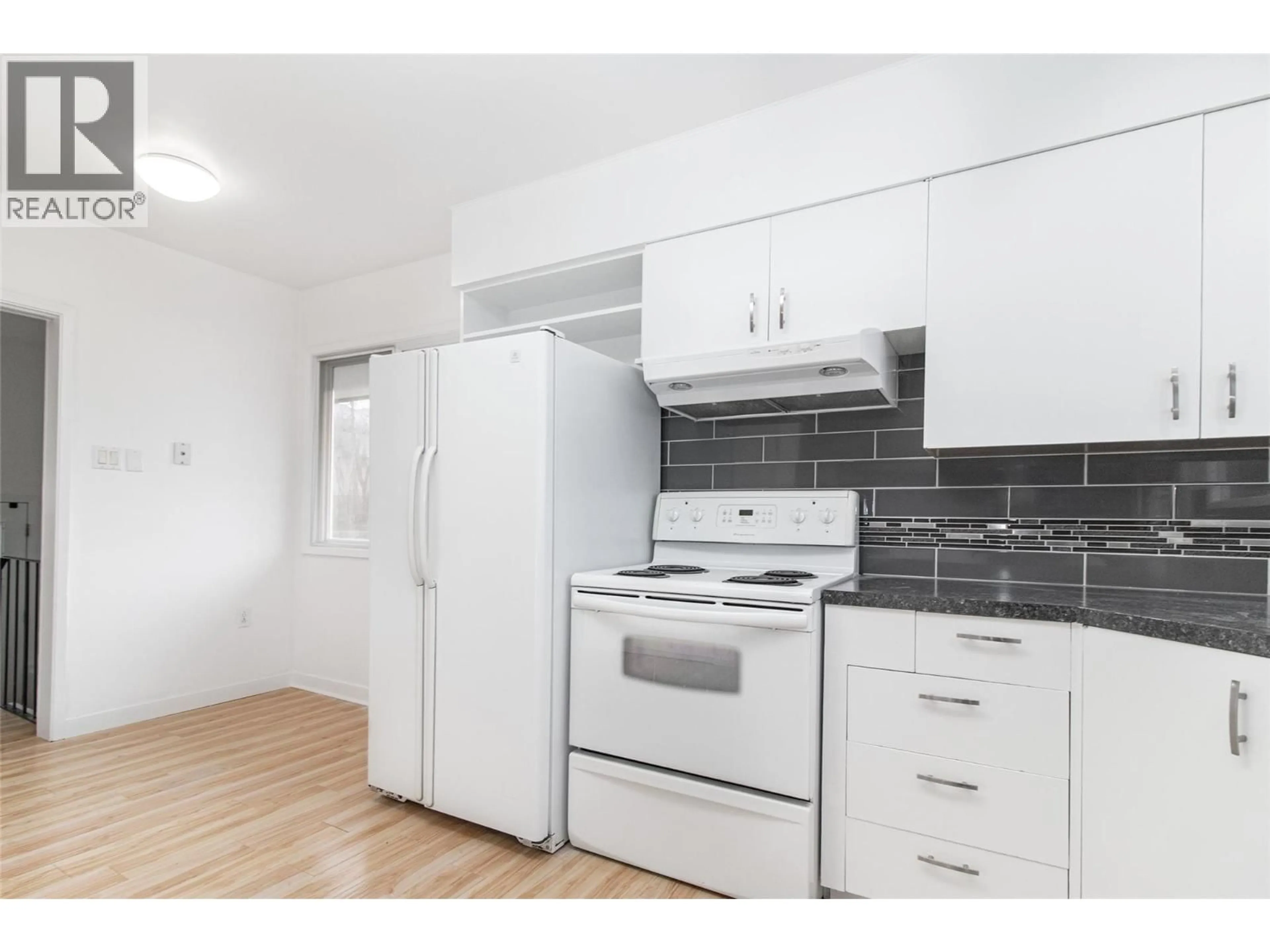 Standard kitchen, wood/laminate floor for 4829 LAKESHORE ROAD, Kelowna British Columbia V1W4H6