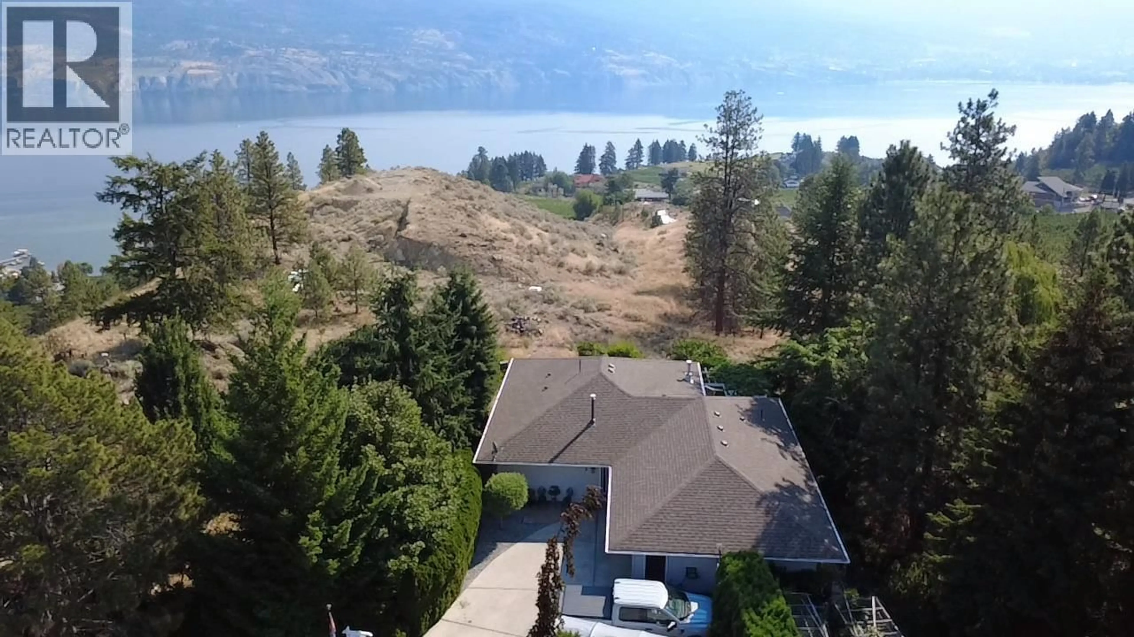 A pic from outside/outdoor area/front of a property/back of a property/a pic from drone, water/lake/river/ocean view for 150 SUMAC RIDGE DRIVE, Summerland British Columbia V0H1Z6