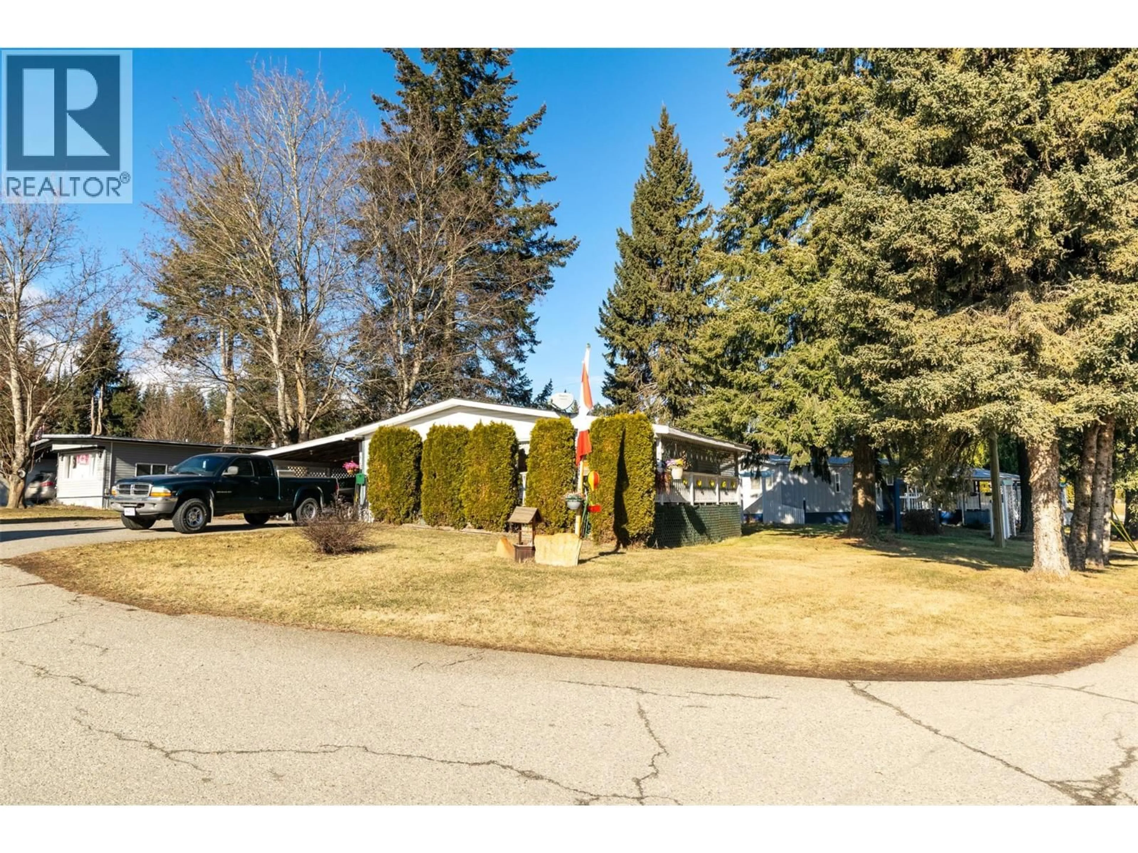 A pic from outside/outdoor area/front of a property/back of a property/a pic from drone, street for 10 - 2500 97B HIGHWAY, Salmon Arm British Columbia V1E1A6