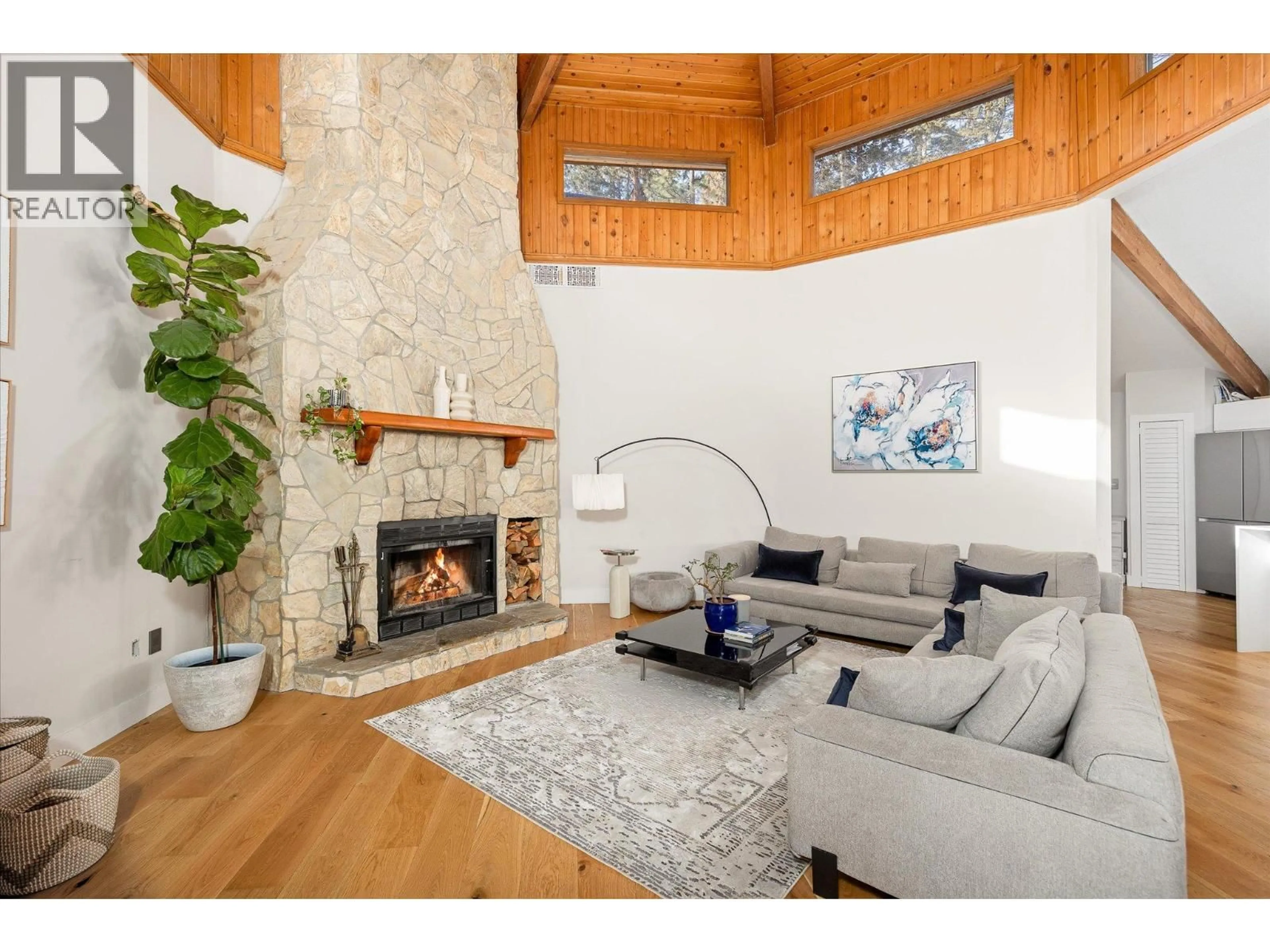 Living room with furniture, wood/laminate floor for 1446 SCOTT CRESCENT, West Kelowna British Columbia V1Z2X6