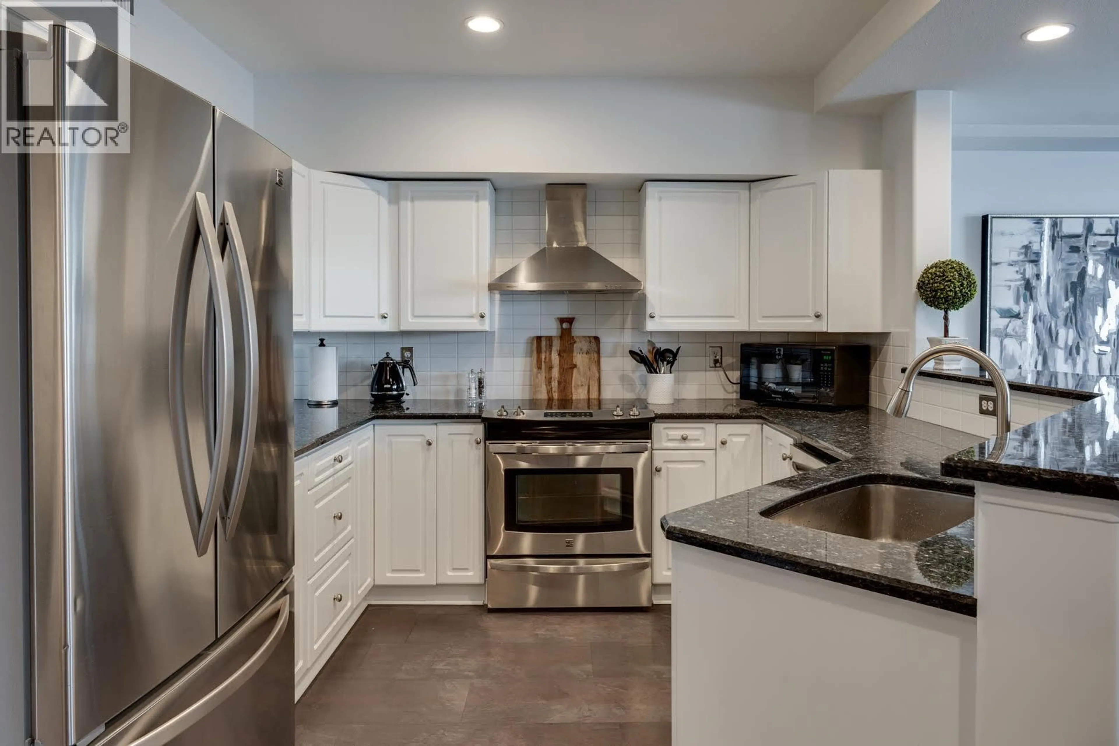 Contemporary kitchen, ceramic/tile floor for 228 - 1088 SUNSET DRIVE, Kelowna British Columbia V1Y9W1