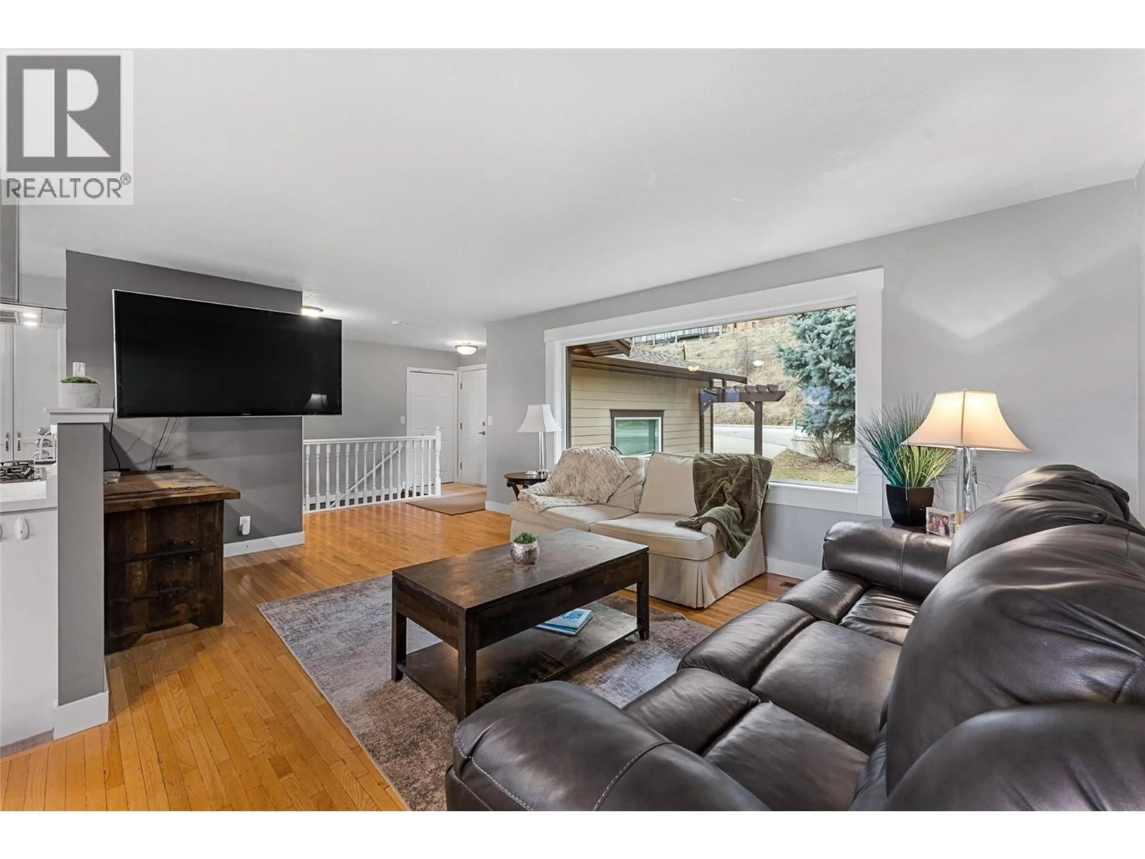 Living room with furniture, wood/laminate floor for 6047 TURNER AVENUE, Peachland British Columbia V0H1X4