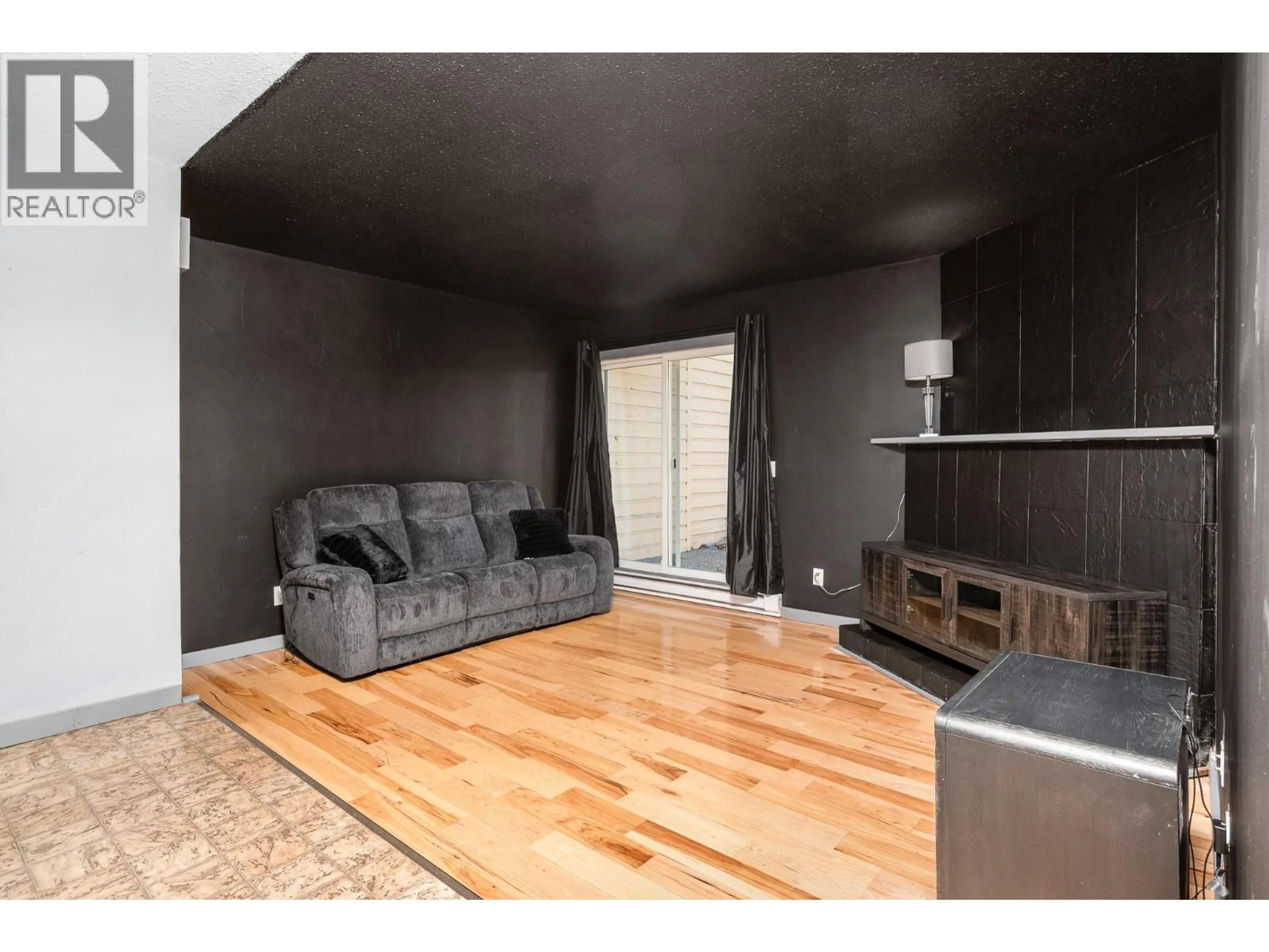 Living room with furniture, wood/laminate floor for 8 - 5300 25 AVENUE, Vernon British Columbia V1T6R4
