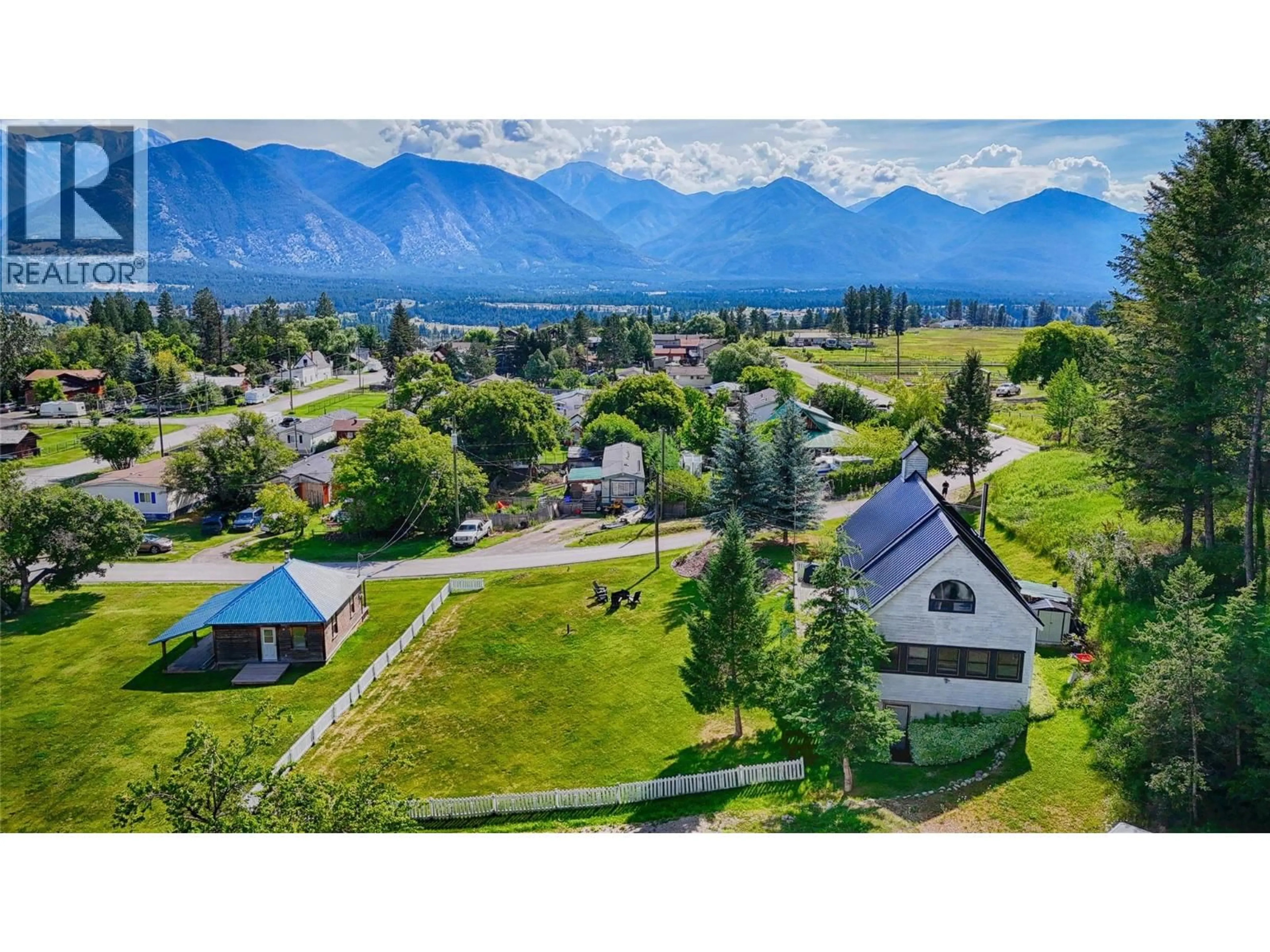 A pic from outside/outdoor area/front of a property/back of a property/a pic from drone, mountain view for 9211 WEST AVENUE, Wilmer British Columbia V0A1K5