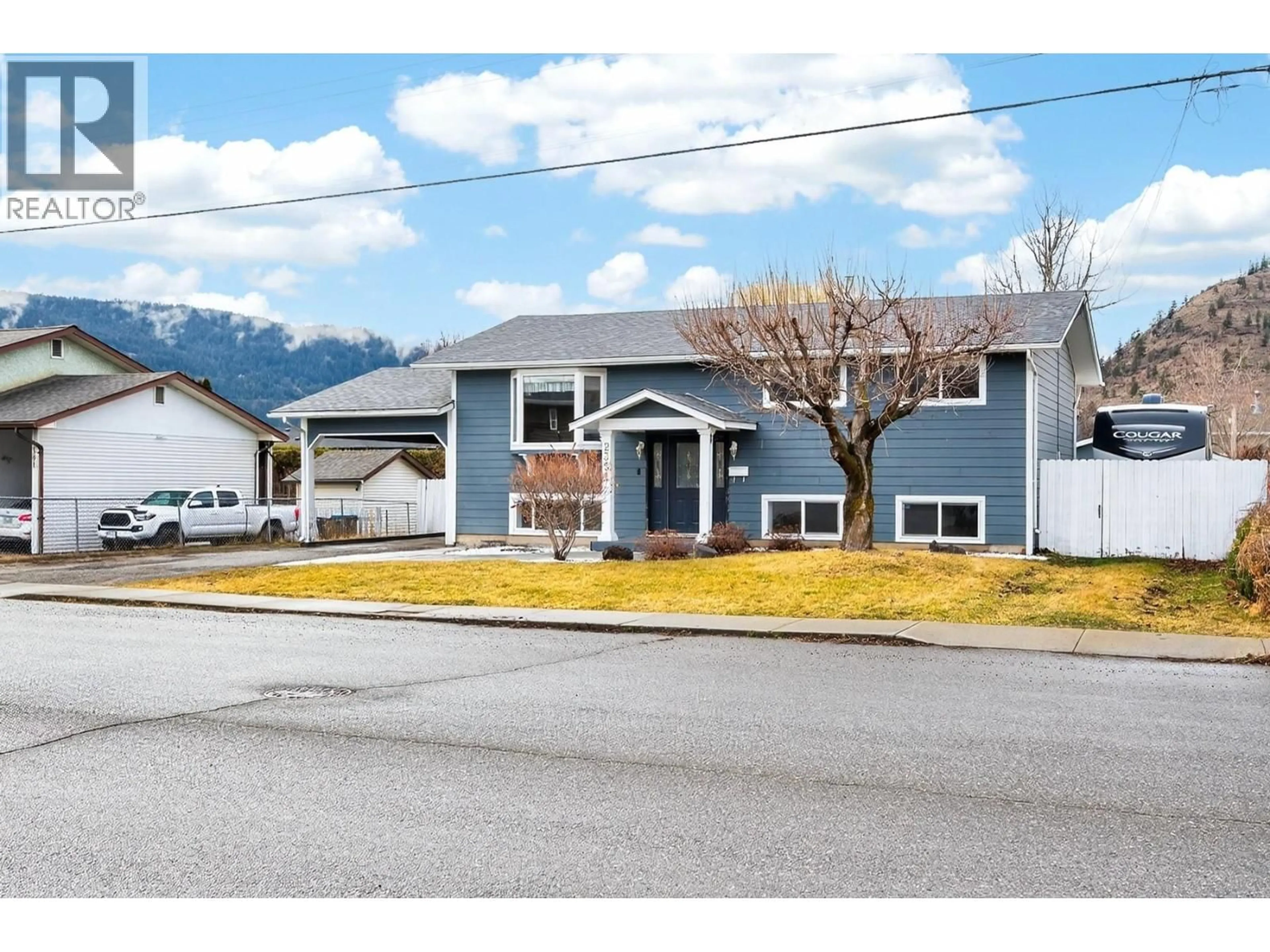 Home with vinyl exterior material, street for 2351 CHAPMAN STREET, Merritt British Columbia V1K1B8