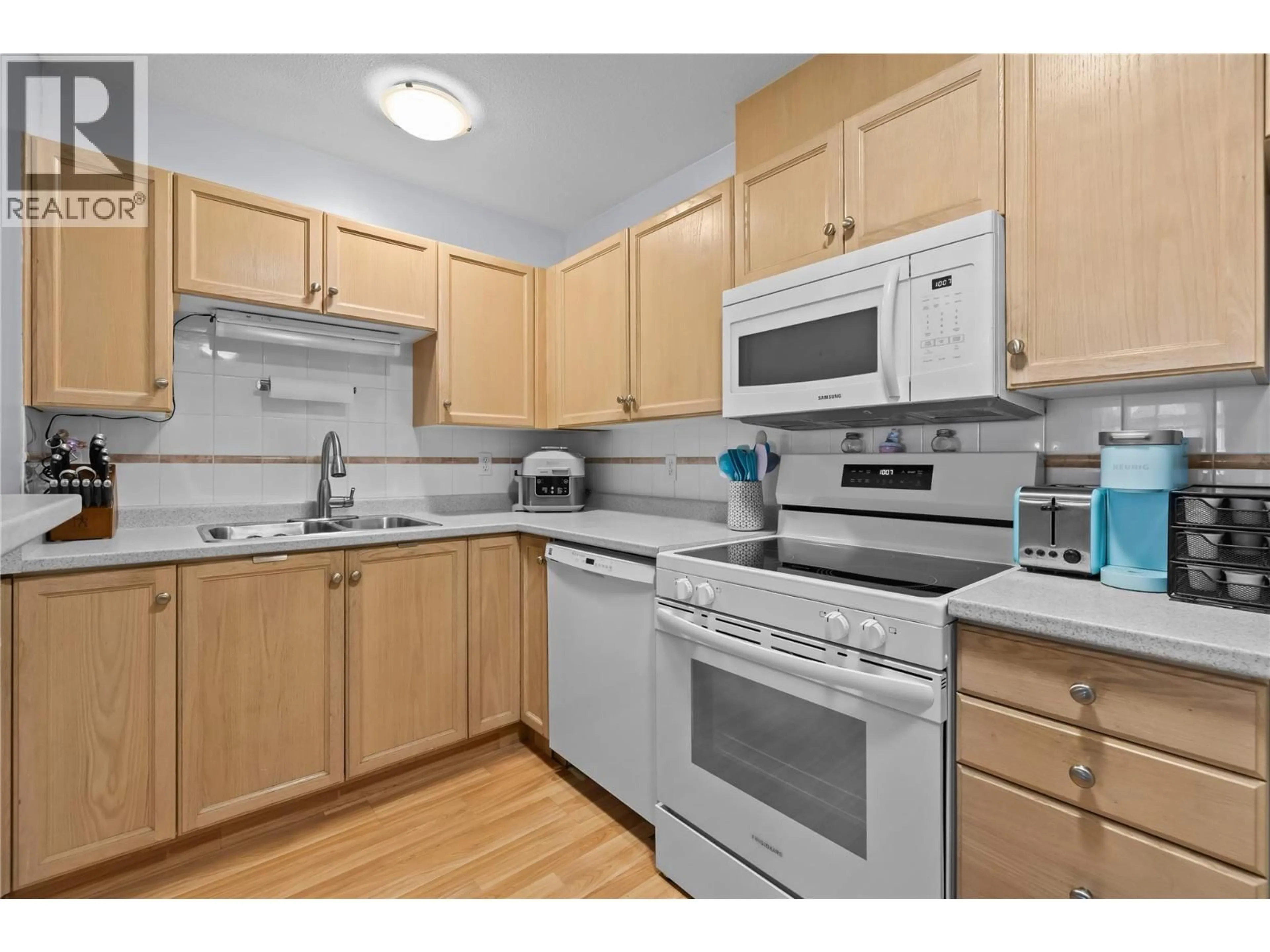 Standard kitchen, wood/laminate floor for 302 - 730 BADKE ROAD, Kelowna British Columbia V1X6G9