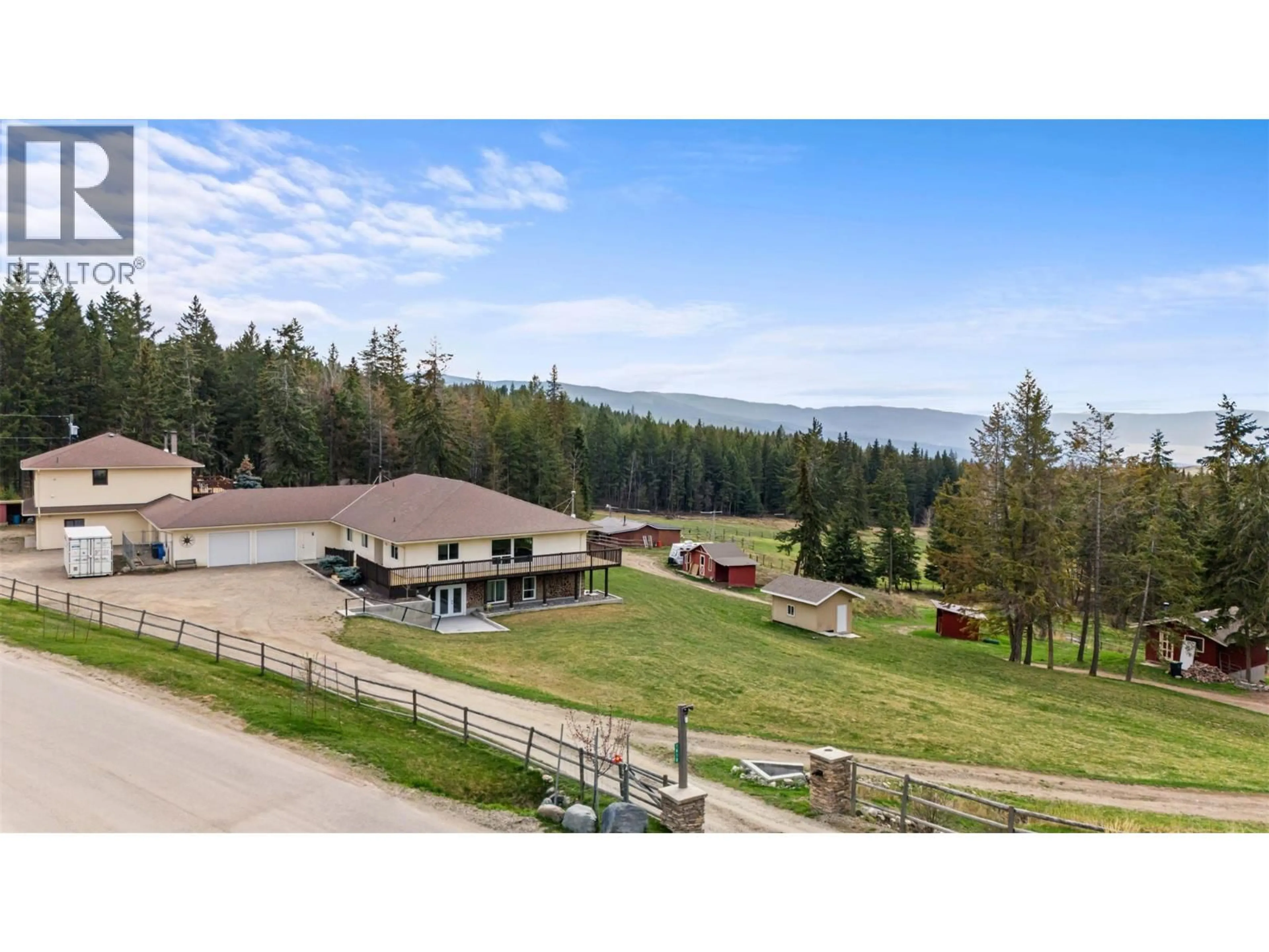 A pic from outside/outdoor area/front of a property/back of a property/a pic from drone, mountain view for 1618 HUCKLEBERRY ROAD, Kelowna British Columbia V1P1M5