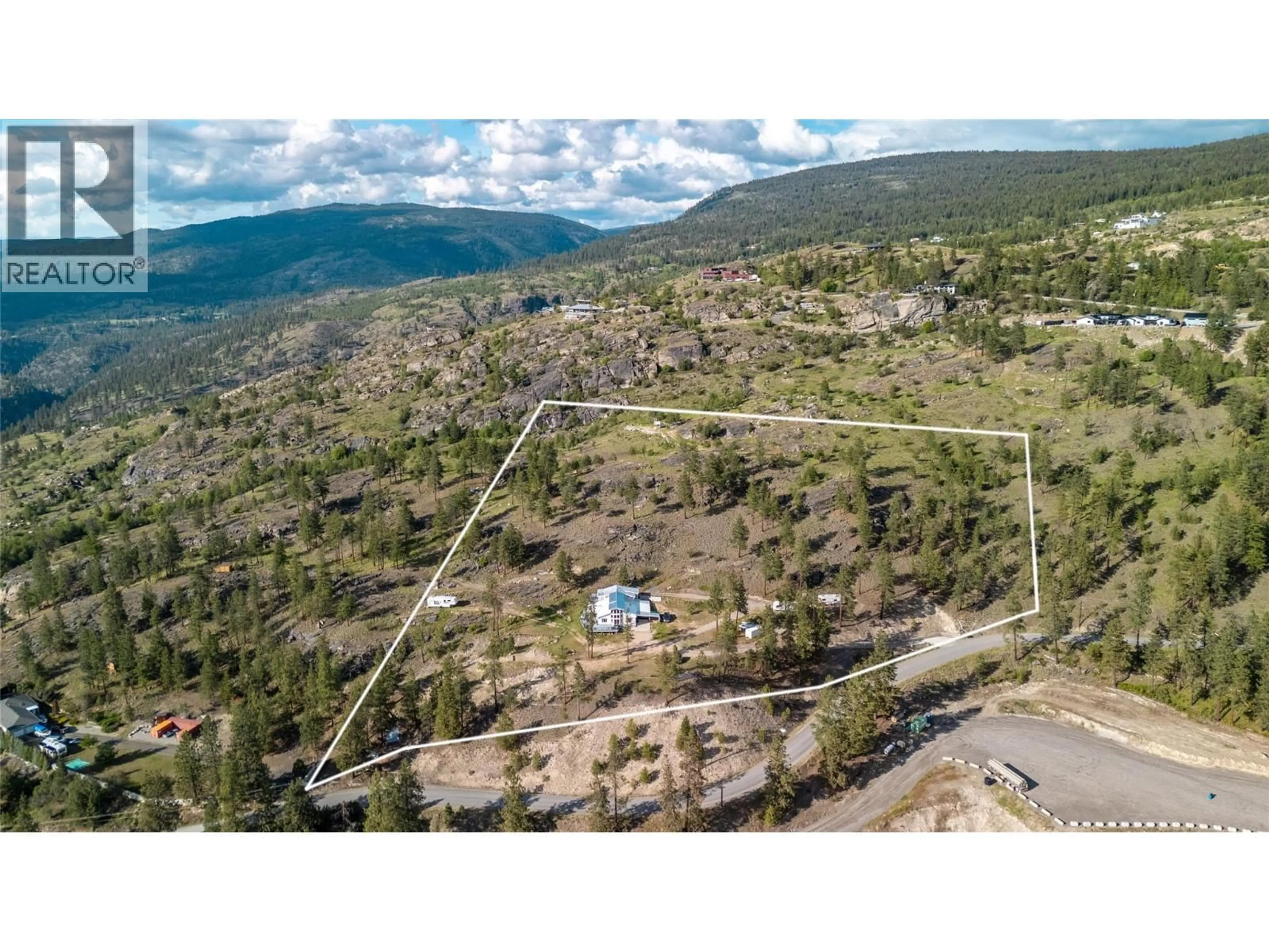 A pic from outside/outdoor area/front of a property/back of a property/a pic from drone, mountain view for 2081 CARMI ROAD, Penticton British Columbia V2A8C5