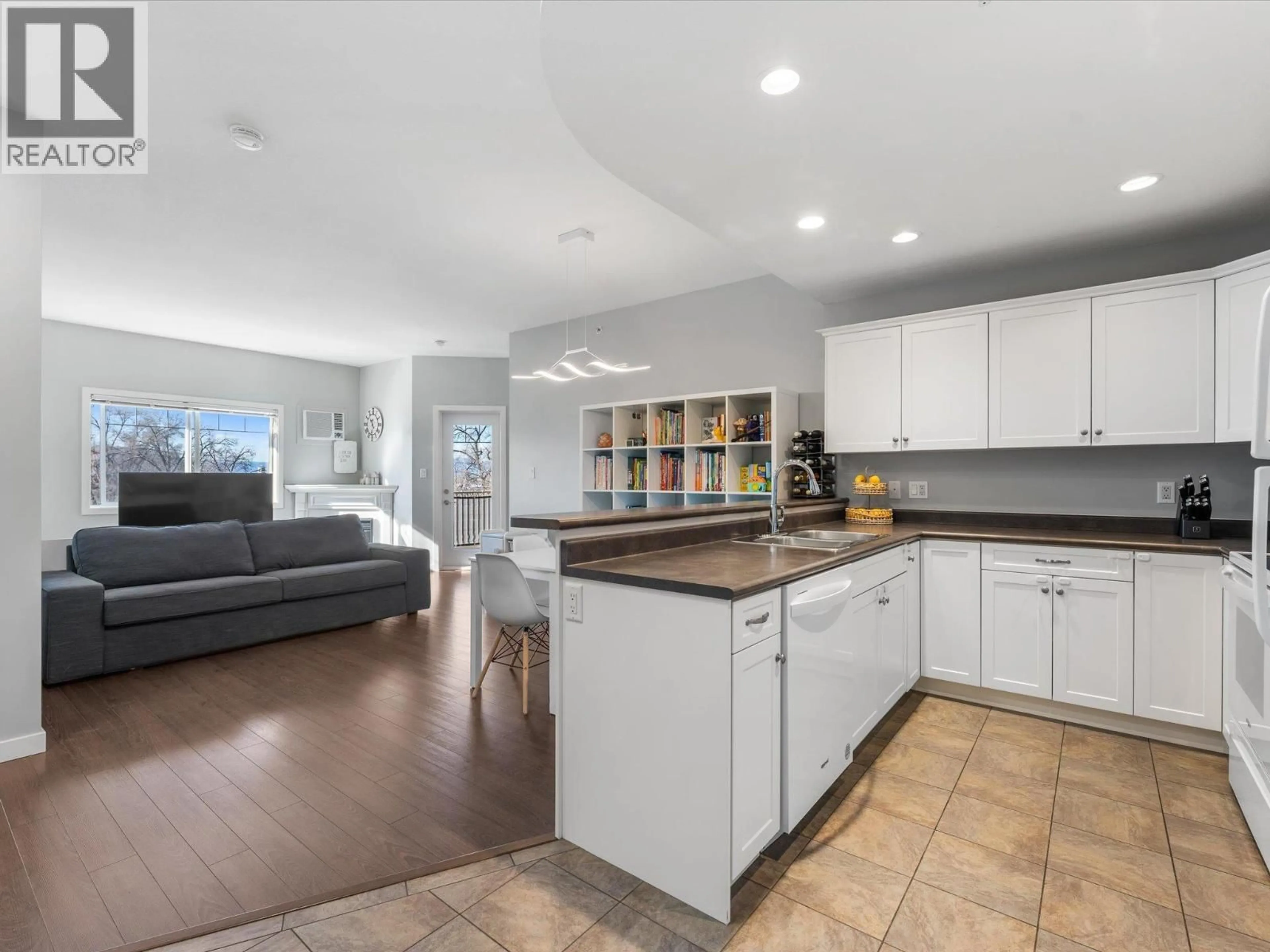 Open concept kitchen, ceramic/tile floor for 302 - 345 MILLS ROAD, Kelowna British Columbia V1X4G9