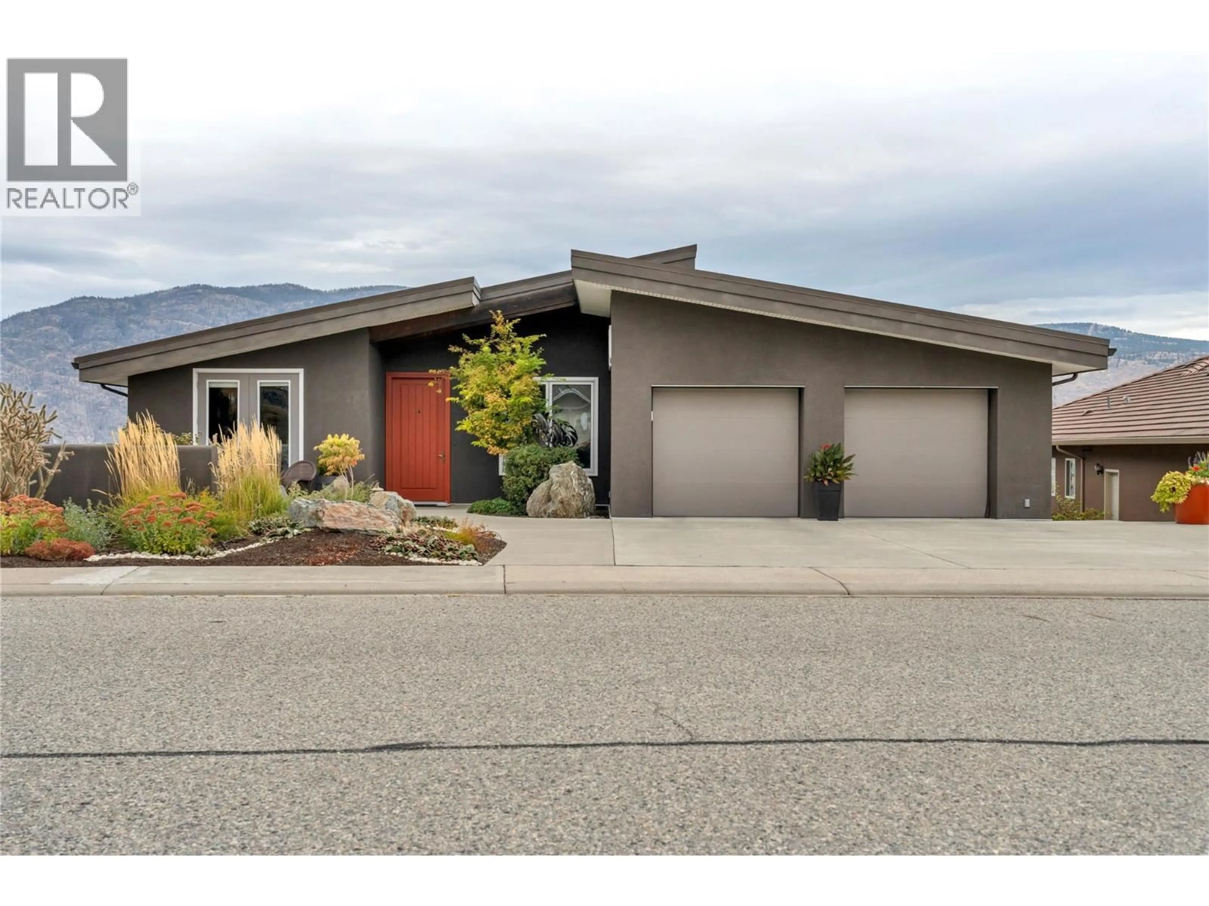 Home with vinyl exterior material, street for 11713 OLYMPIC VIEW DRIVE, Osoyoos British Columbia V0H1V4