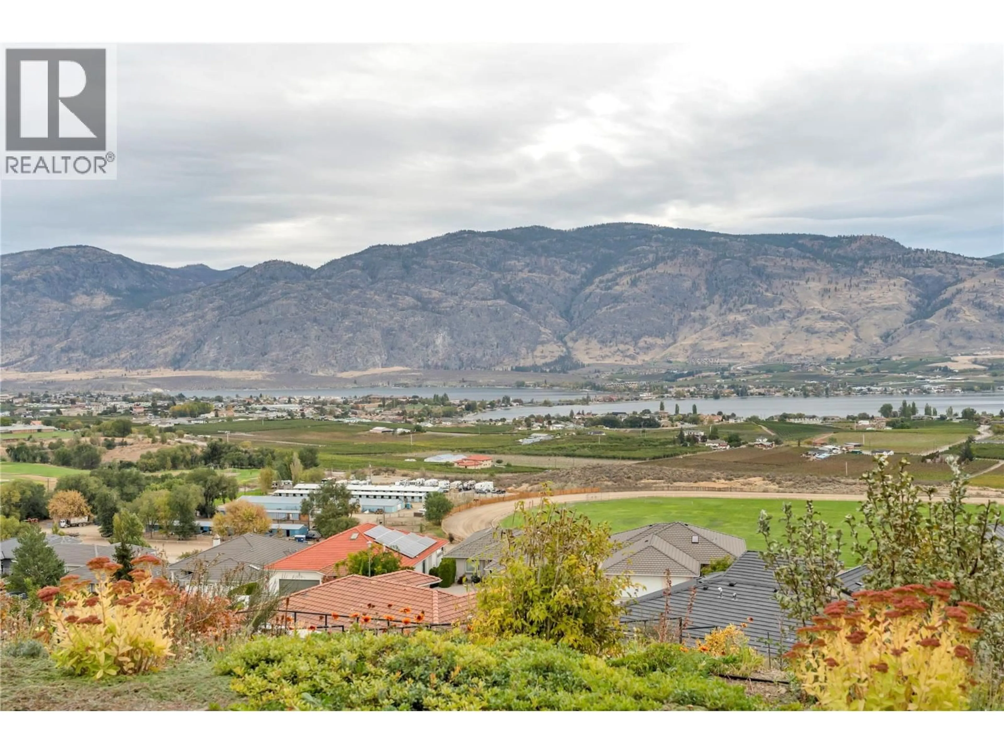 A pic from outside/outdoor area/front of a property/back of a property/a pic from drone, mountain view for 11713 OLYMPIC VIEW DRIVE, Osoyoos British Columbia V0H1V4