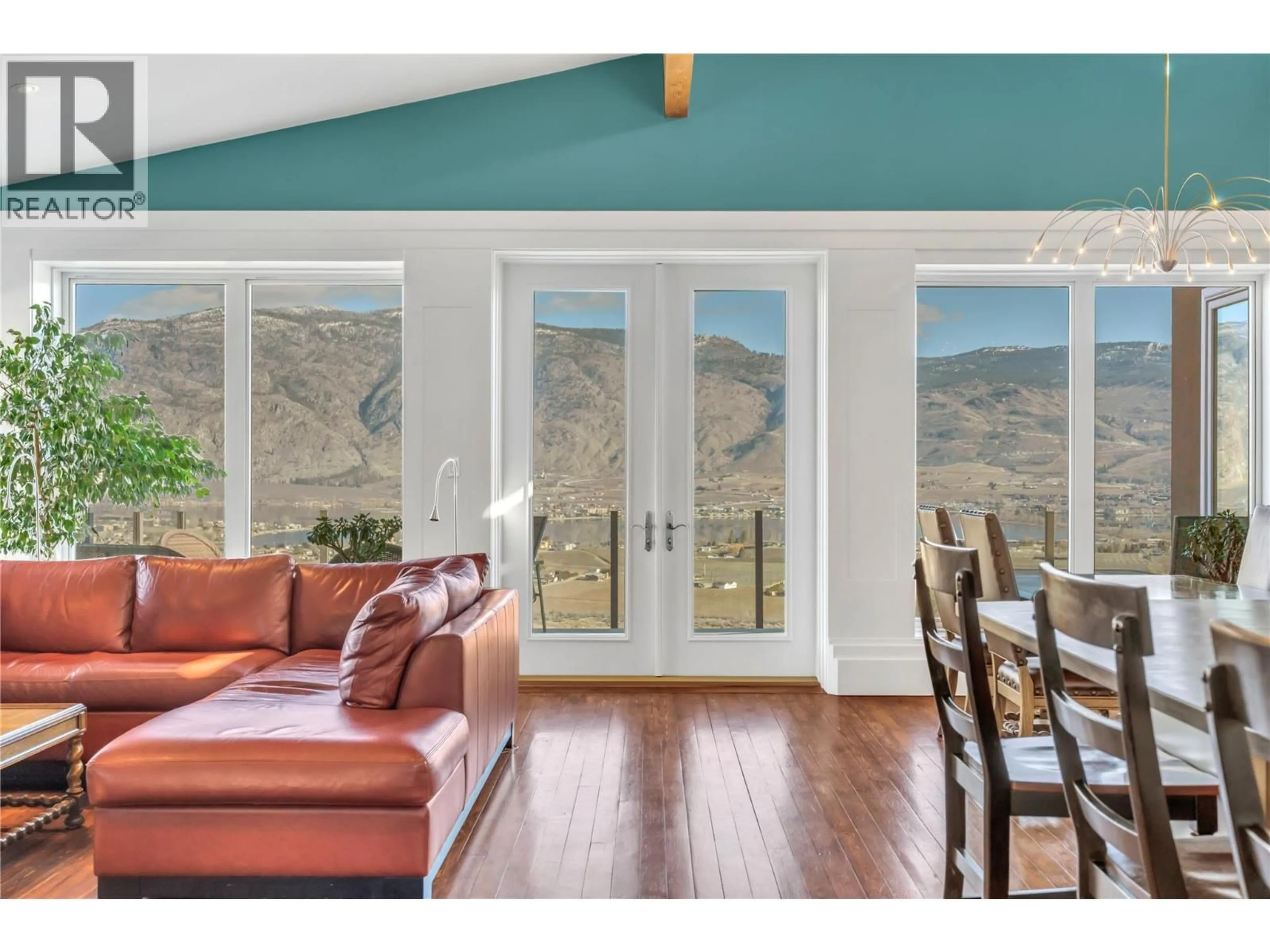 Living room with furniture, wood/laminate floor for 11713 OLYMPIC VIEW DRIVE, Osoyoos British Columbia V0H1V4