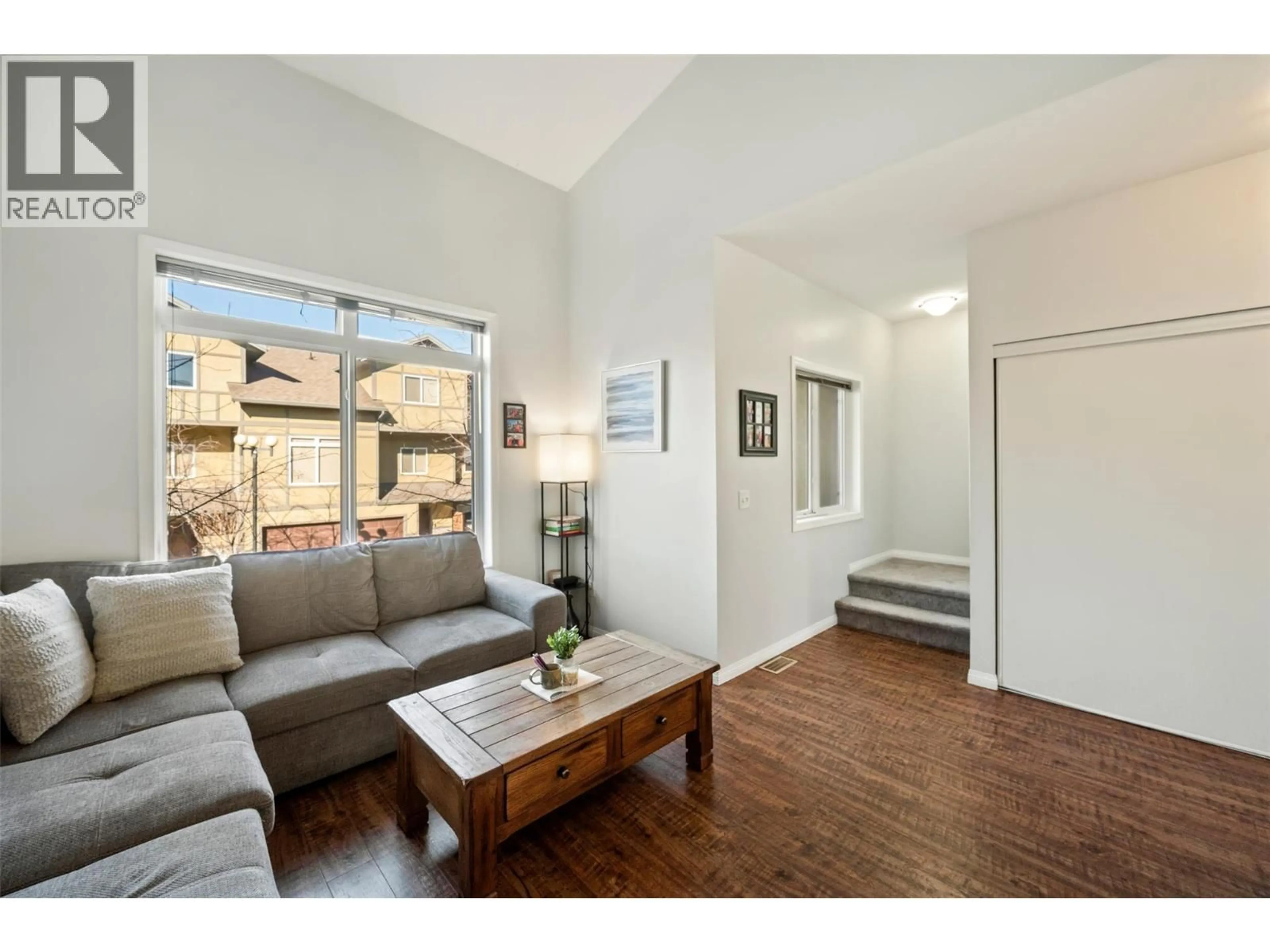 Living room with furniture, wood/laminate floor for 132 - 48 GALT AVENUE, Penticton British Columbia V2A9C3