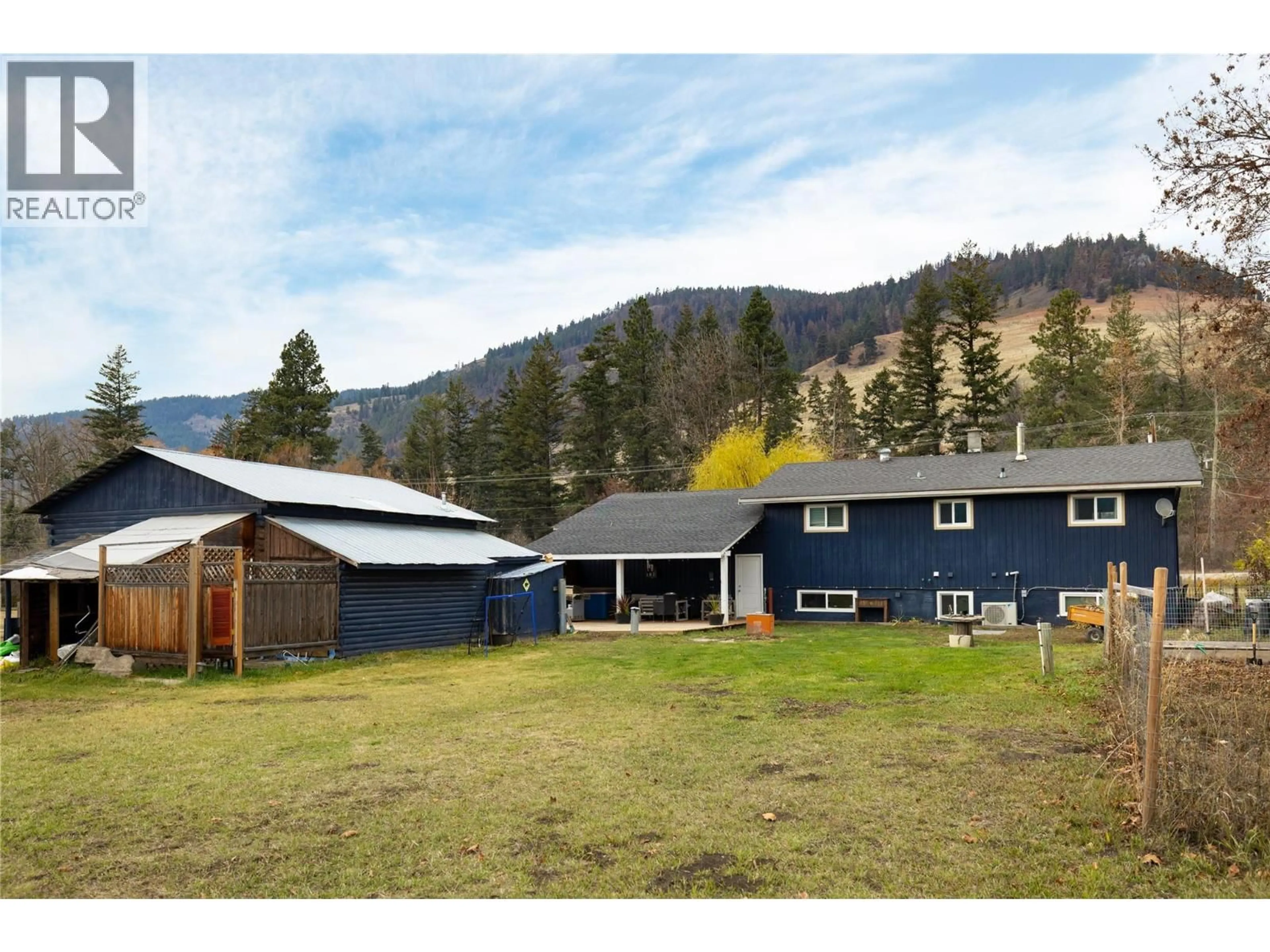 A pic from outside/outdoor area/front of a property/back of a property/a pic from drone, mountain view for 5712 6 HIGHWAY, Vernon British Columbia V1B3E1