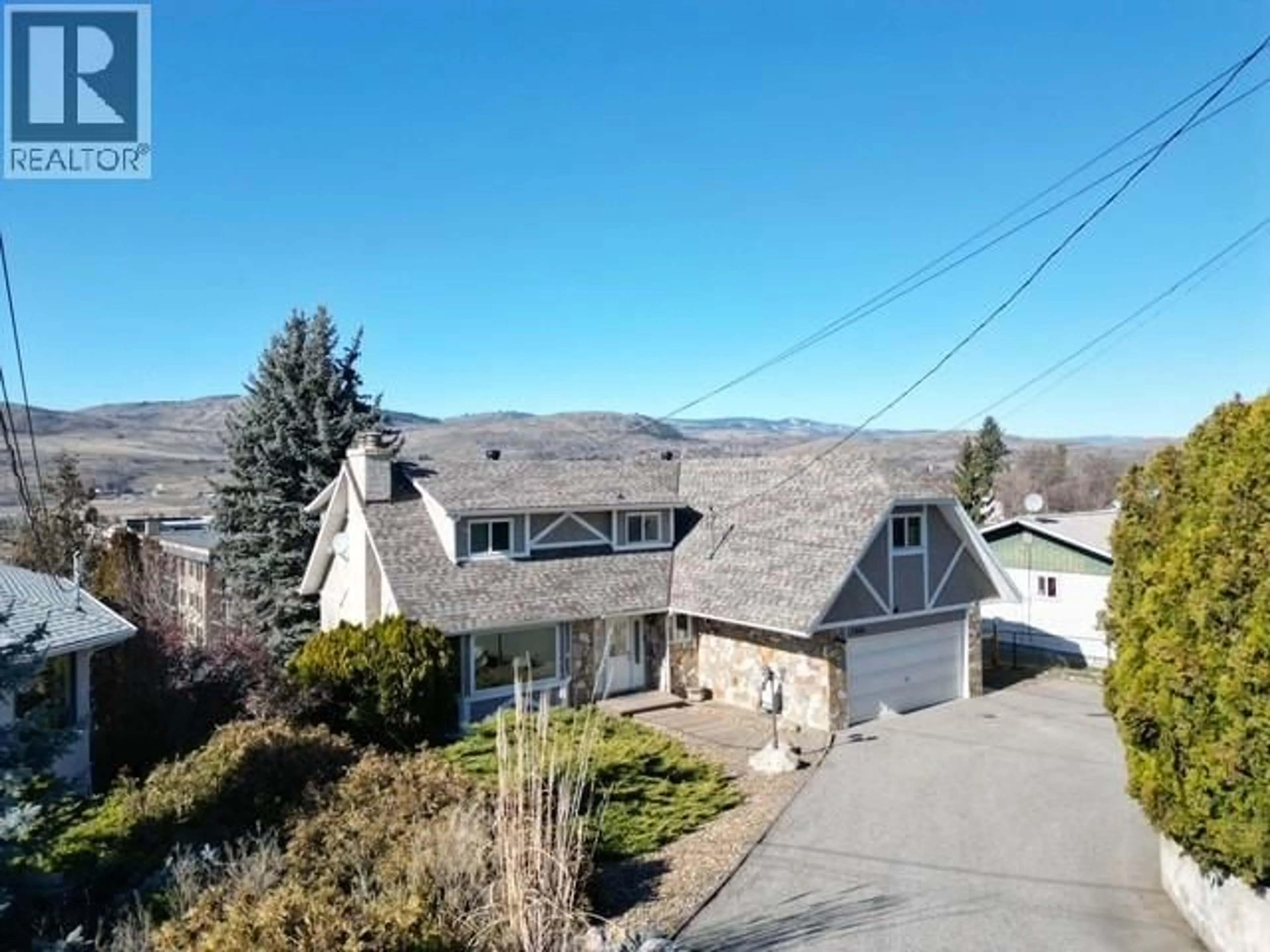 A pic from outside/outdoor area/front of a property/back of a property/a pic from drone, mountain view for 5844 PLEASANT VALLEY ROAD, Vernon British Columbia V1B3L6