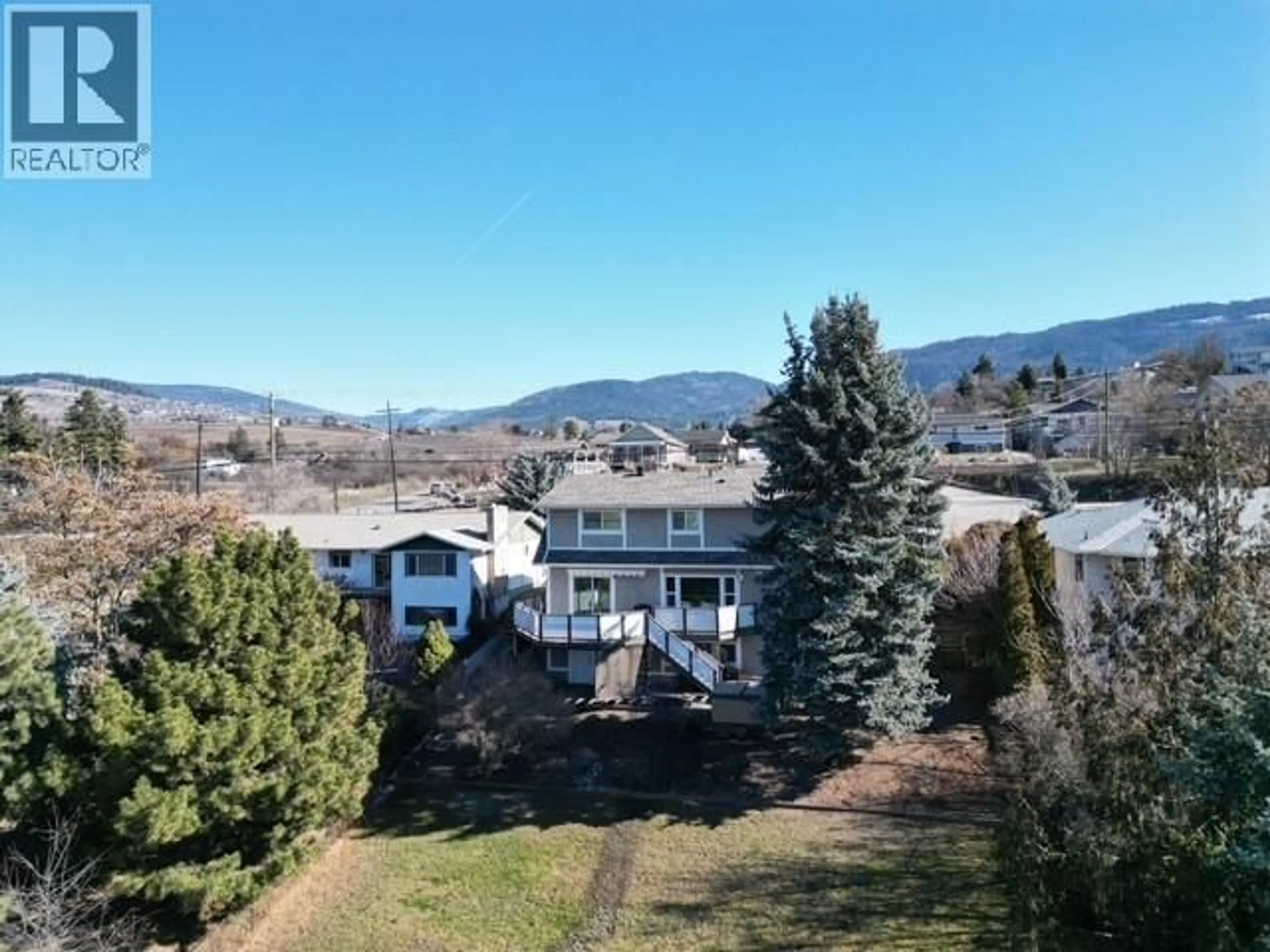 A pic from outside/outdoor area/front of a property/back of a property/a pic from drone, mountain view for 5844 PLEASANT VALLEY ROAD, Vernon British Columbia V1B3L6