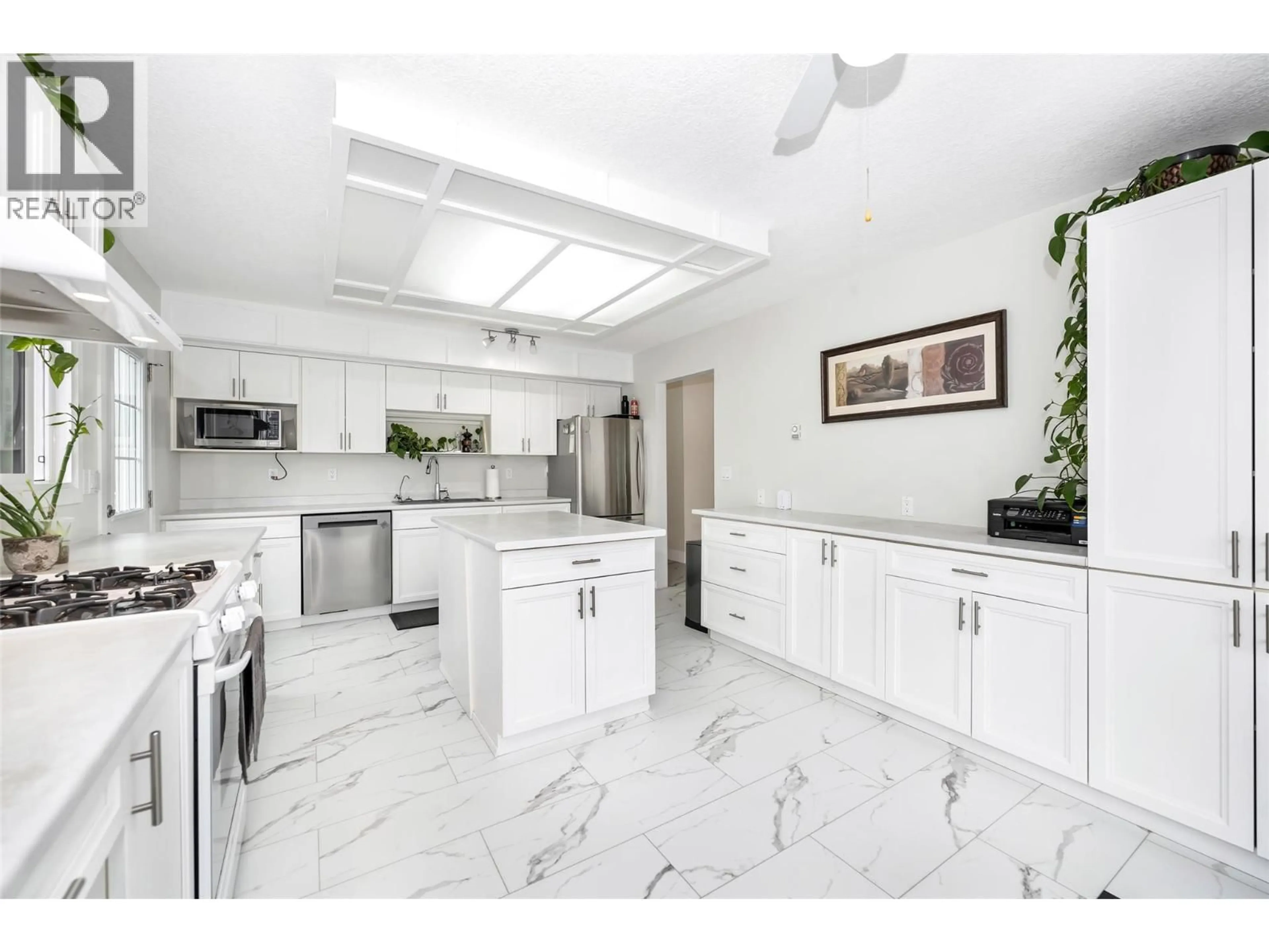 Open concept kitchen, ceramic/tile floor for 5844 PLEASANT VALLEY ROAD, Vernon British Columbia V1B3L6