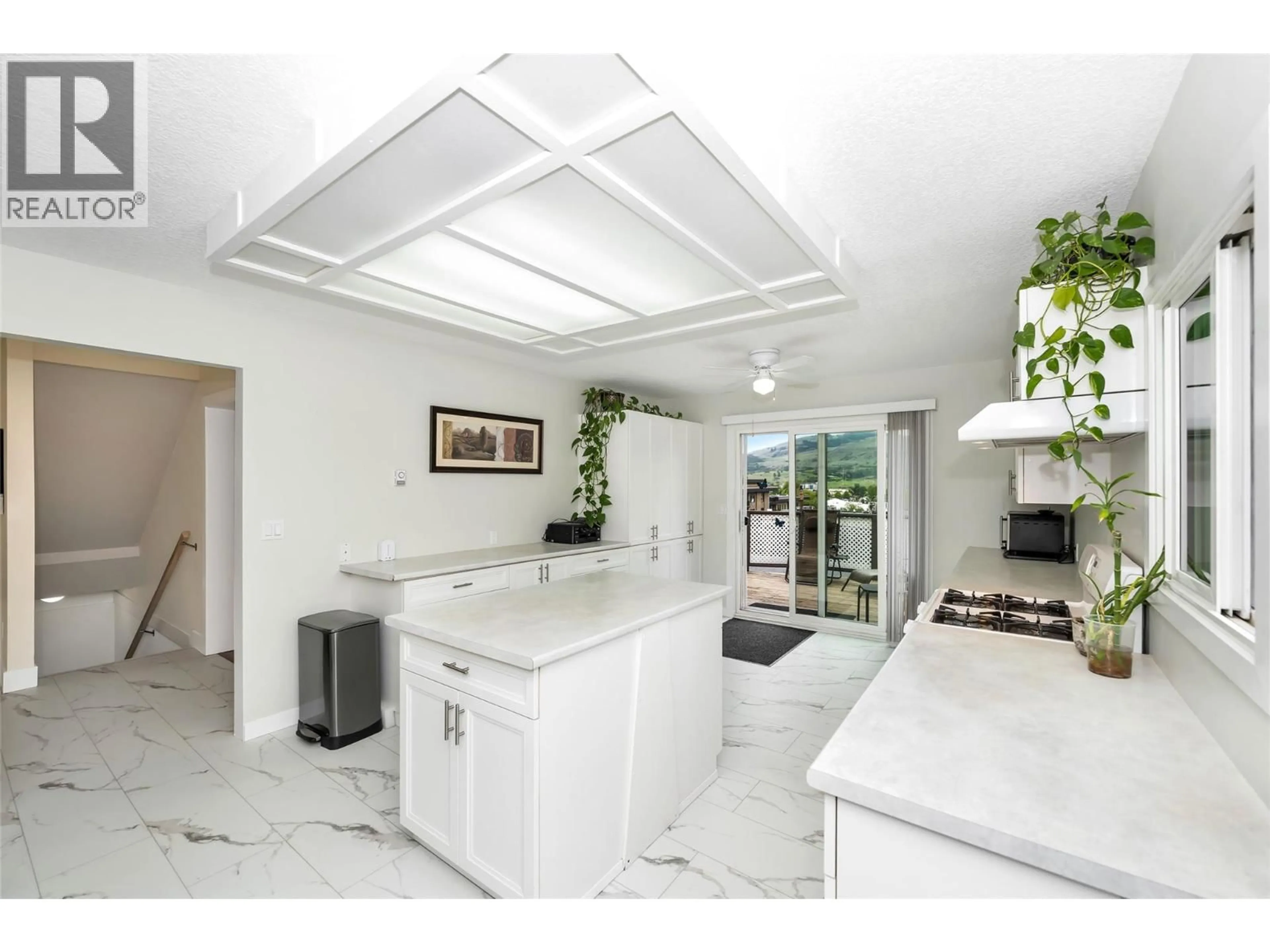 Open concept kitchen, ceramic/tile floor for 5844 PLEASANT VALLEY ROAD, Vernon British Columbia V1B3L6