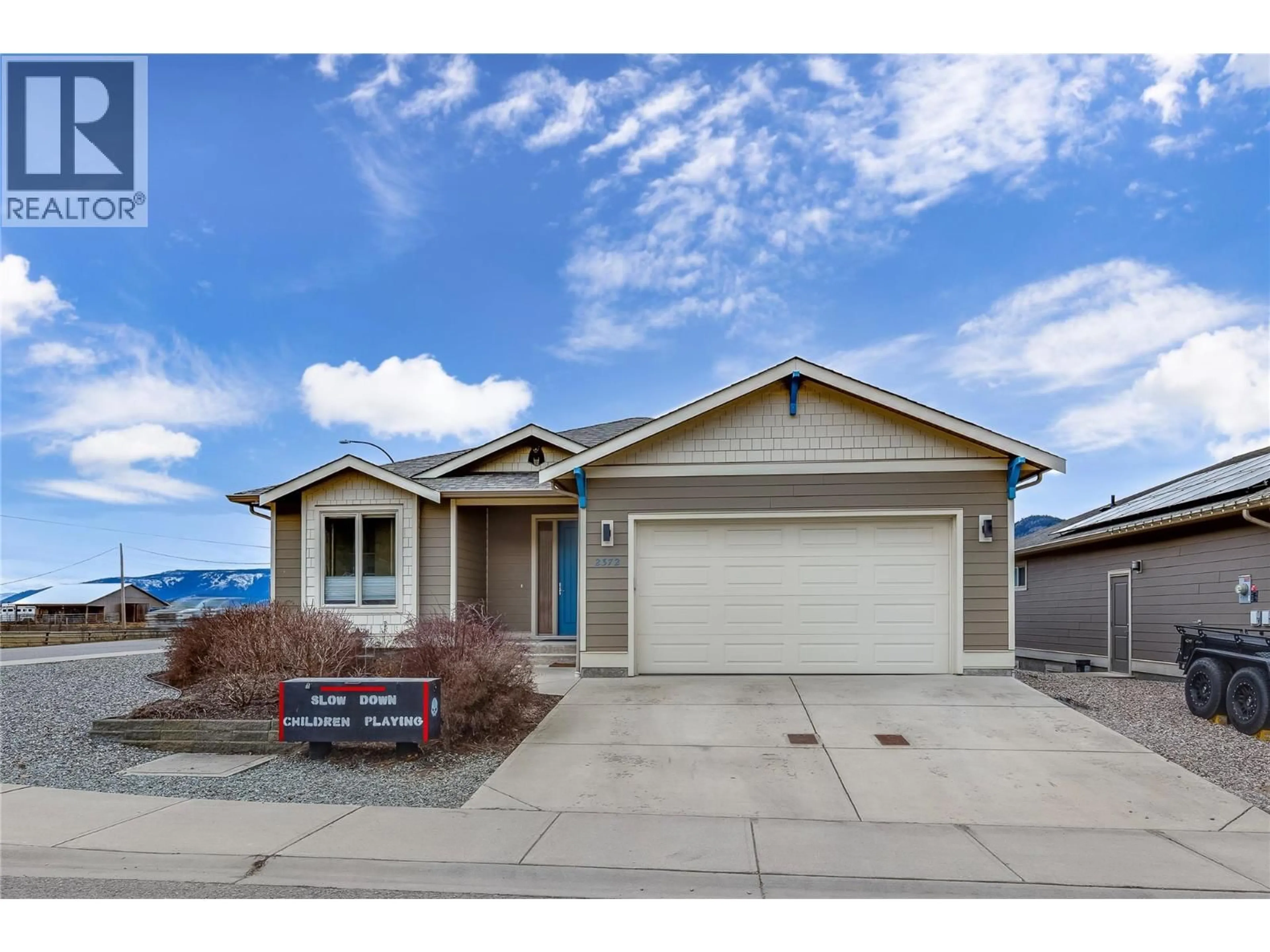 Home with vinyl exterior material, street for 2372 OGLOW DRIVE, Armstrong British Columbia V4Y0V9