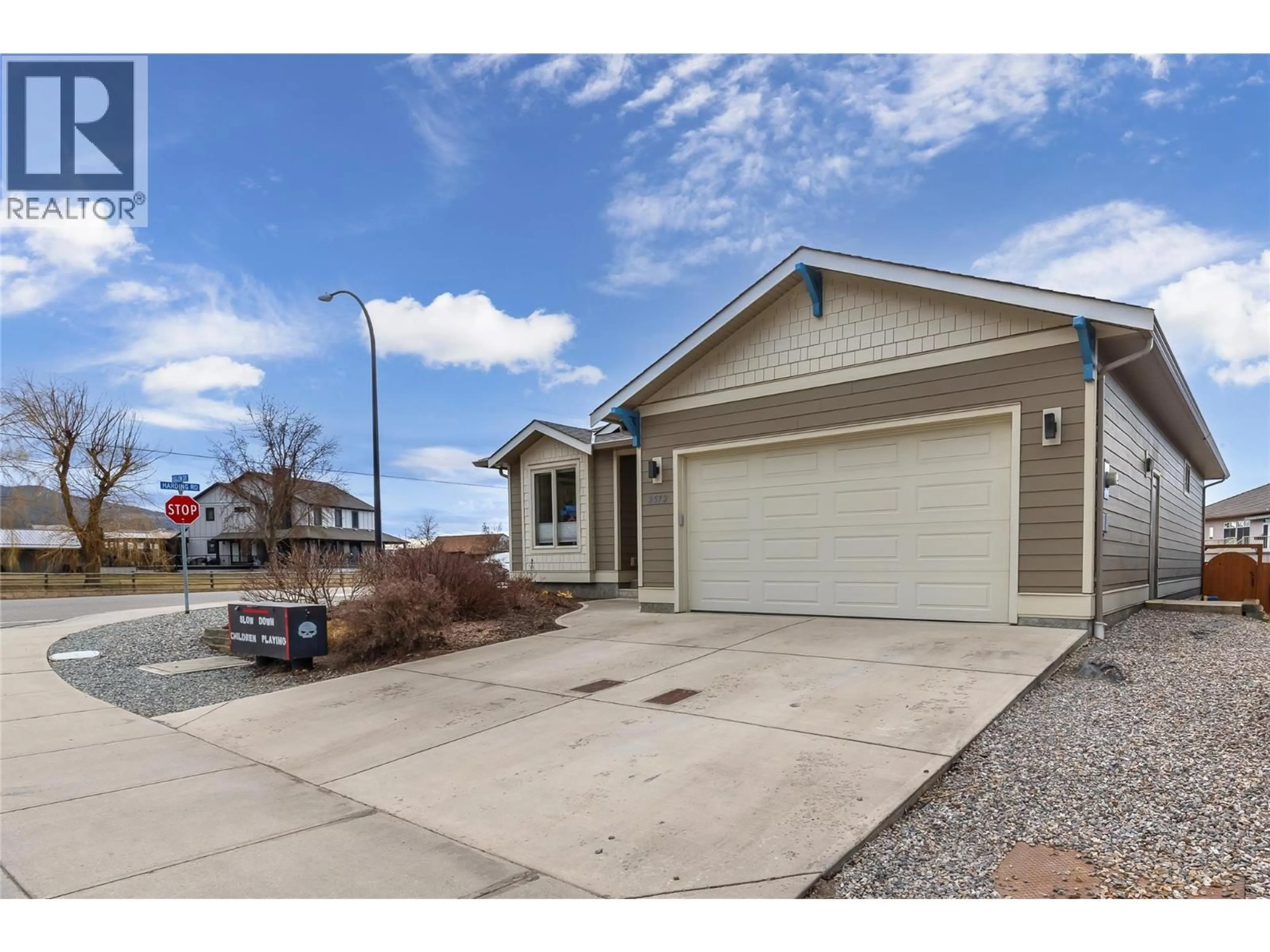 Home with vinyl exterior material, street for 2372 OGLOW DRIVE, Armstrong British Columbia V4Y0V9