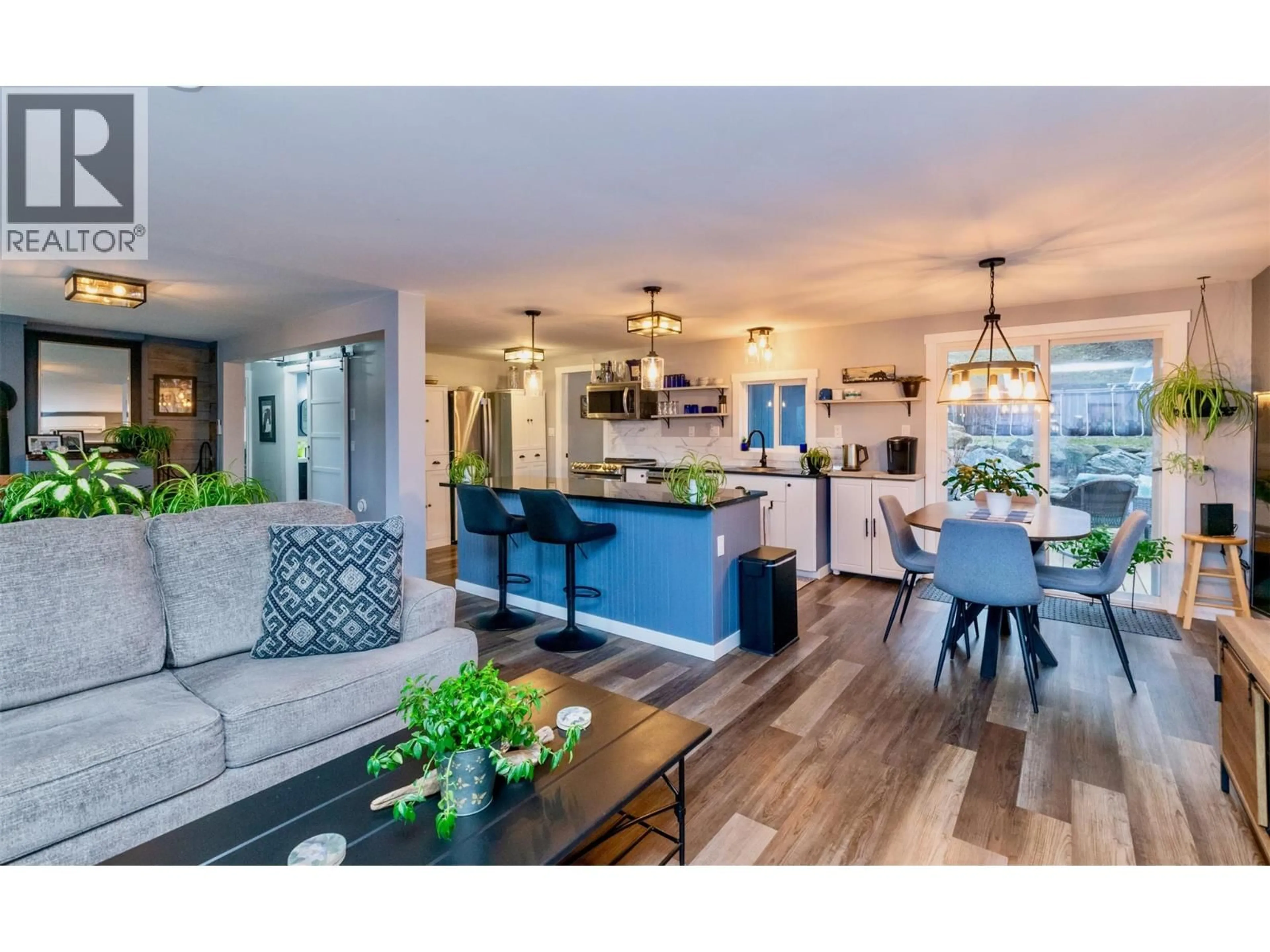 Open concept kitchen, wood/laminate floor for 7519 ANGLEMONT DRIVE, Anglemont British Columbia V0E1M8