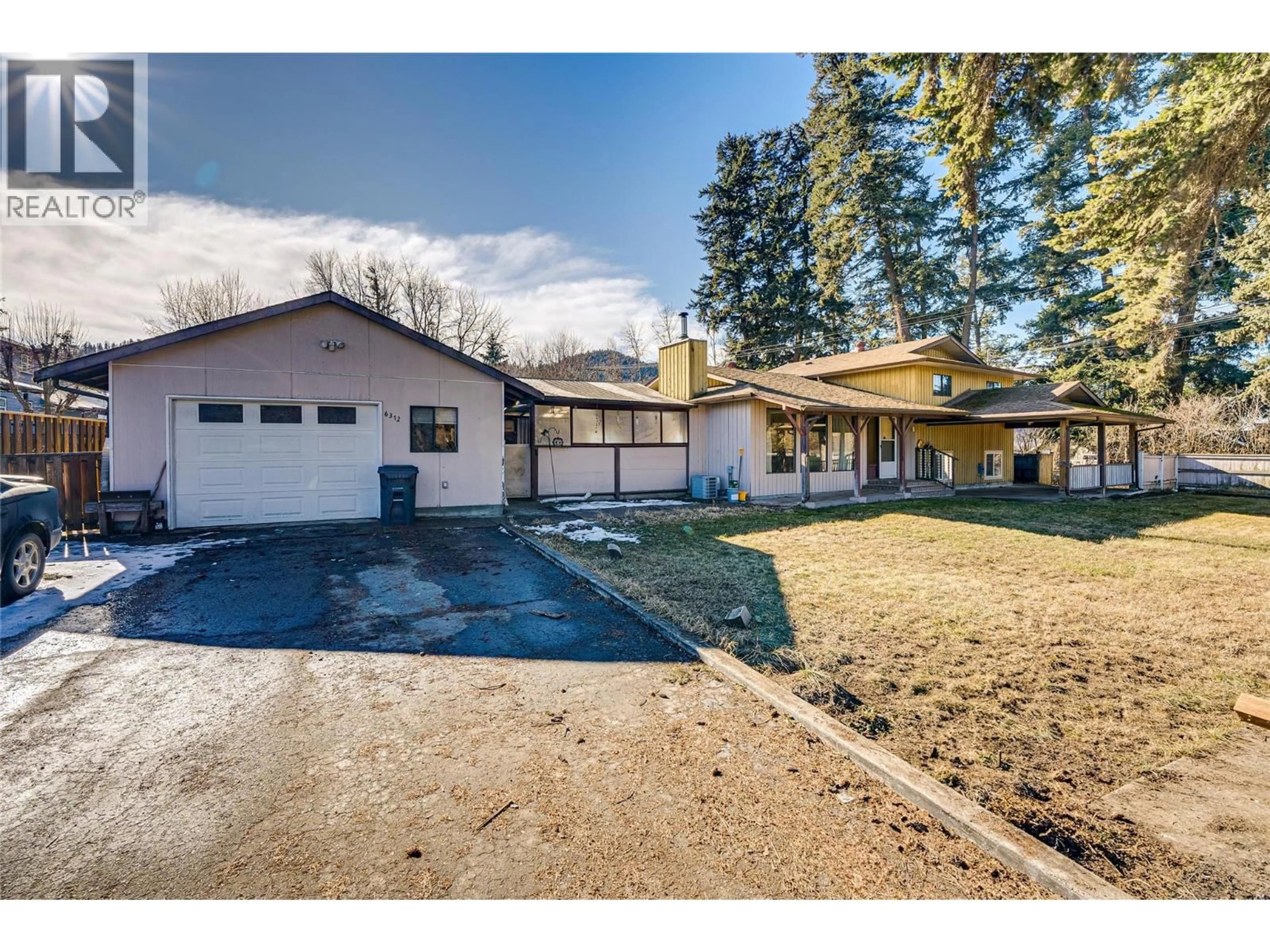 A pic from outside/outdoor area/front of a property/back of a property/a pic from drone, street for 6312 LEARMOUTH ROAD, Coldstream British Columbia V1B3G3