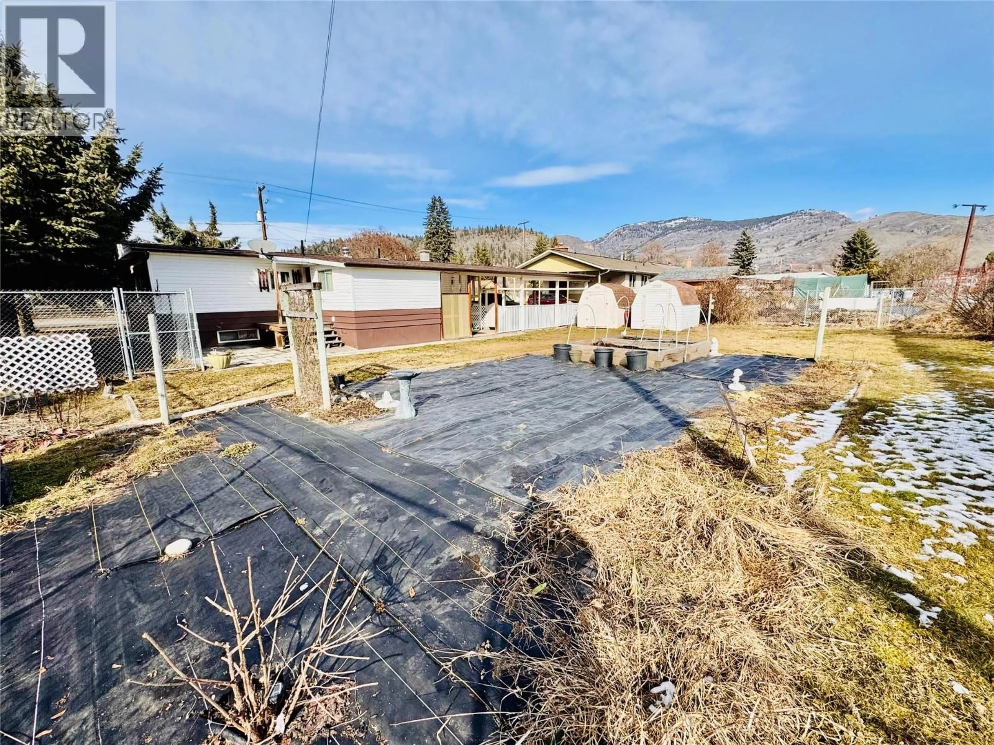 A pic from outside/outdoor area/front of a property/back of a property/a pic from drone, mountain view for 1564 68TH AVENUE, Grand Forks British Columbia V0H1H0