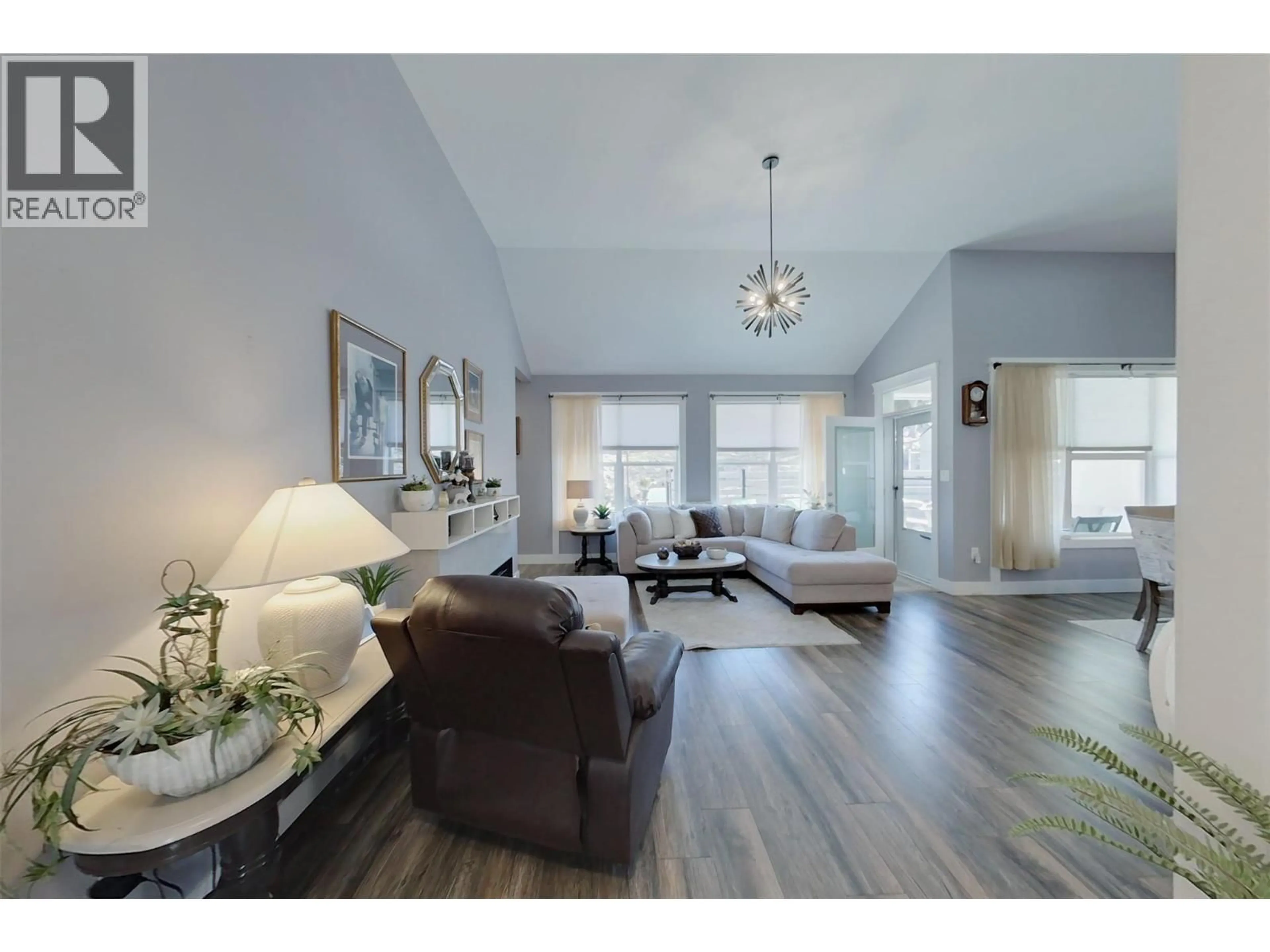 Living room with furniture, wood/laminate floor for 3807 FAIRWINDS DRIVE, Osoyoos British Columbia V0H1V4