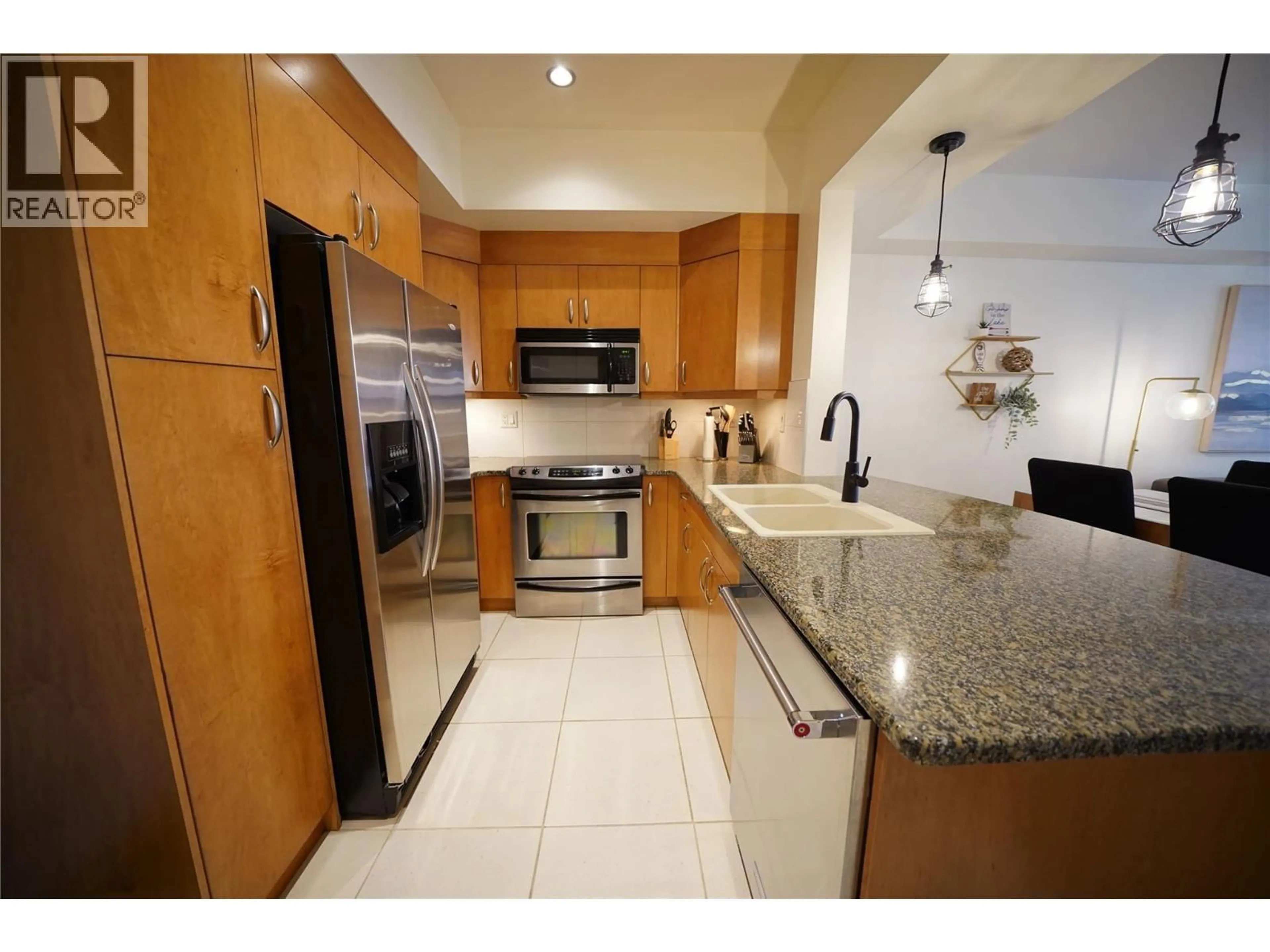 Standard kitchen, ceramic/tile floor for 1119 - 7343 OKANAGAN LANDING ROAD, Vernon British Columbia V1H2J6