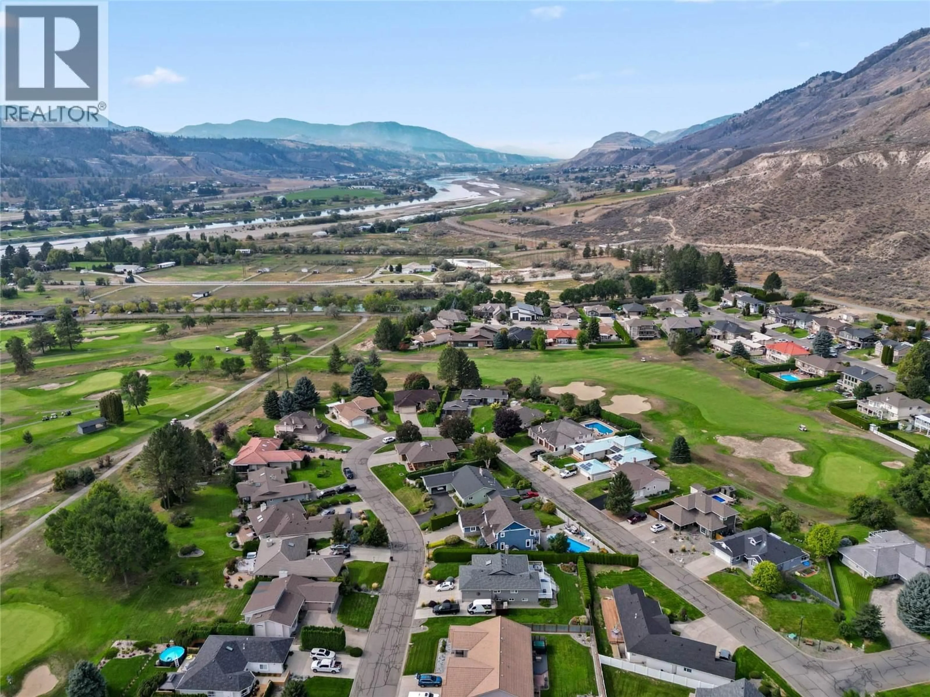 A pic from outside/outdoor area/front of a property/back of a property/a pic from drone, mountain view for 449 NUEVA WYND, Kamloops British Columbia V2H1S1