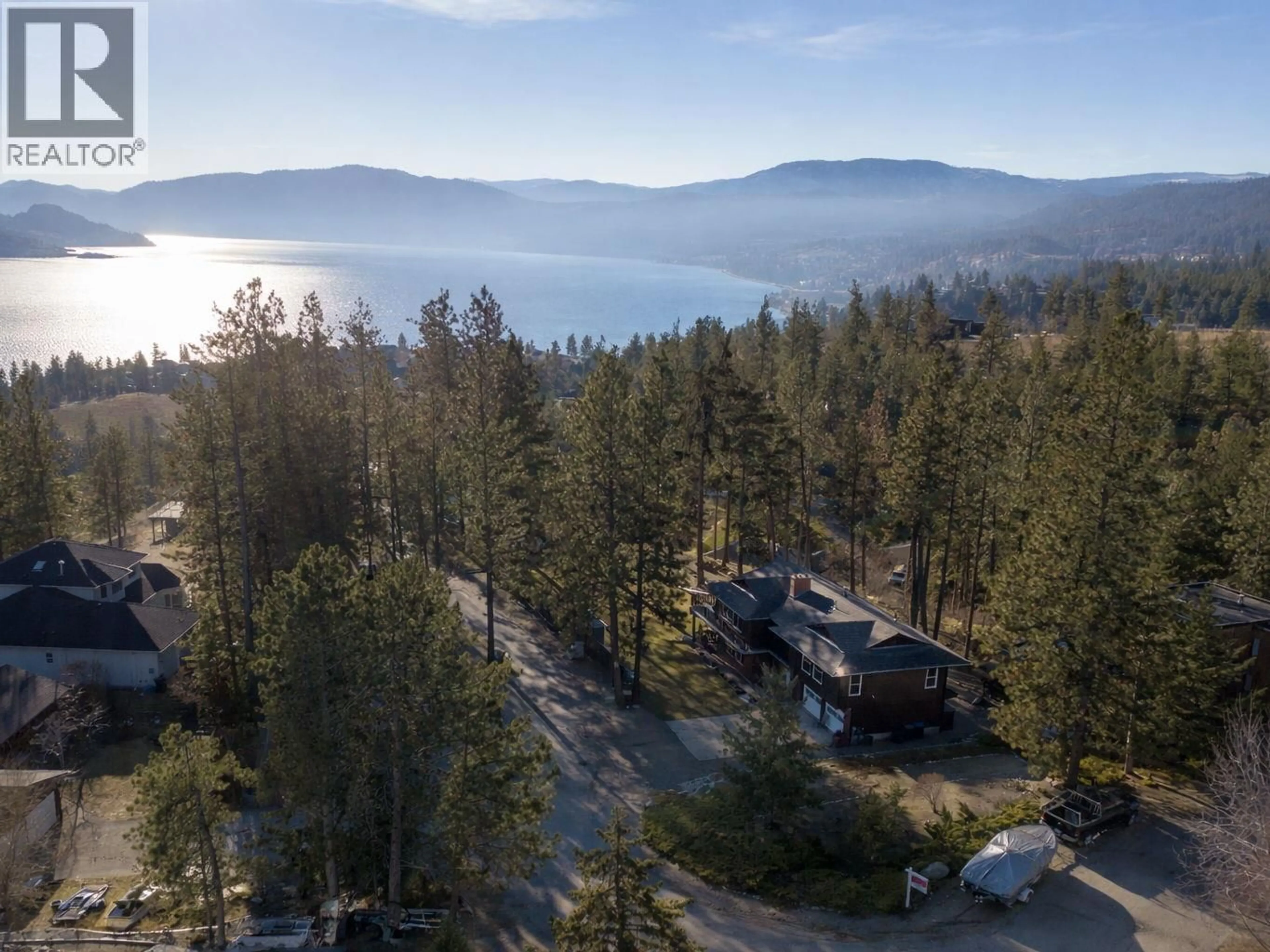A pic from outside/outdoor area/front of a property/back of a property/a pic from drone, forest/trees view for 3947 TREPANIER HEIGHTS PLACE, Peachland British Columbia V0H1X2