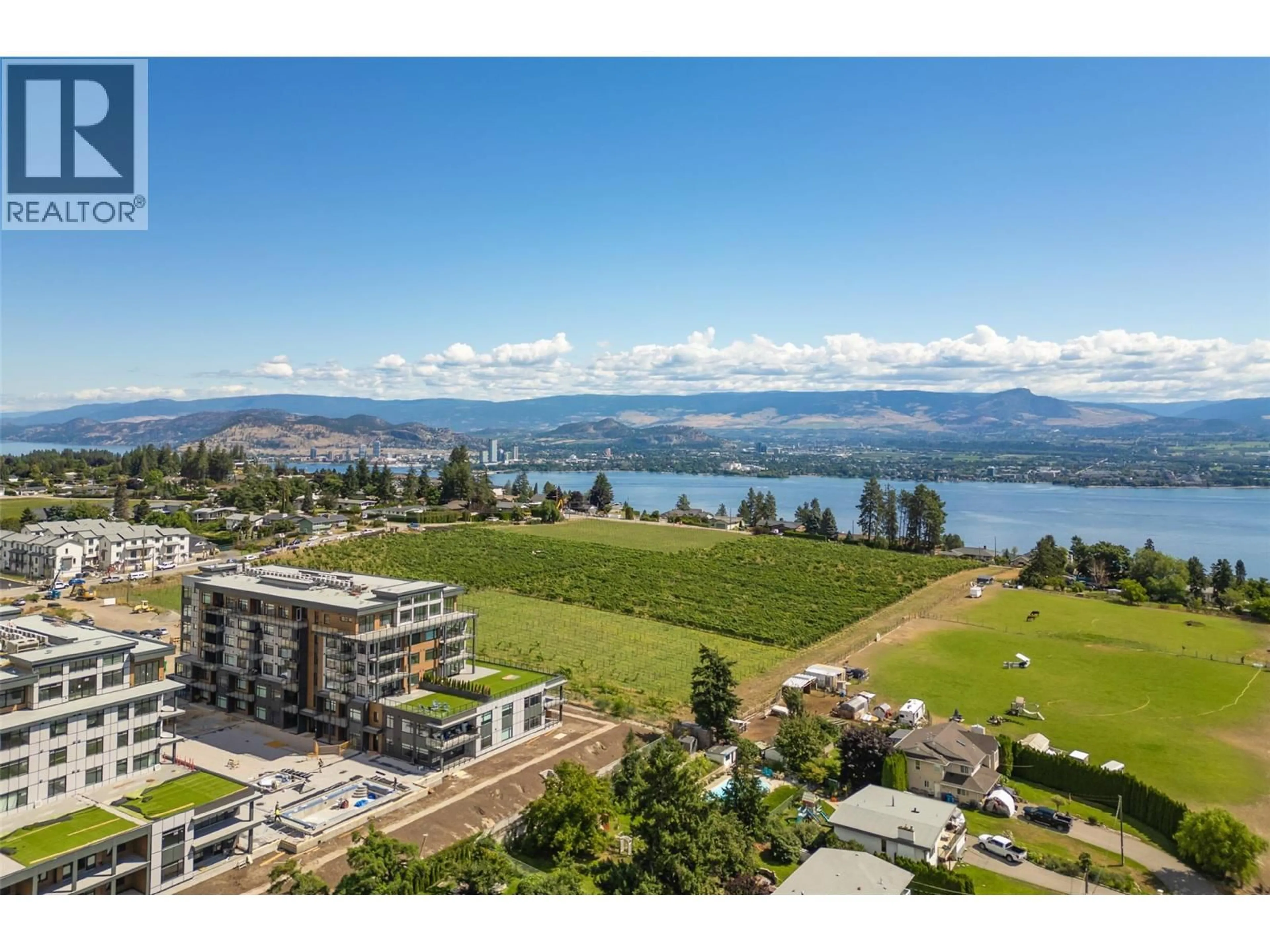 A pic from outside/outdoor area/front of a property/back of a property/a pic from drone, water/lake/river/ocean view for 107 - 2760 OLALLA ROAD, West Kelowna British Columbia V1Z2A9