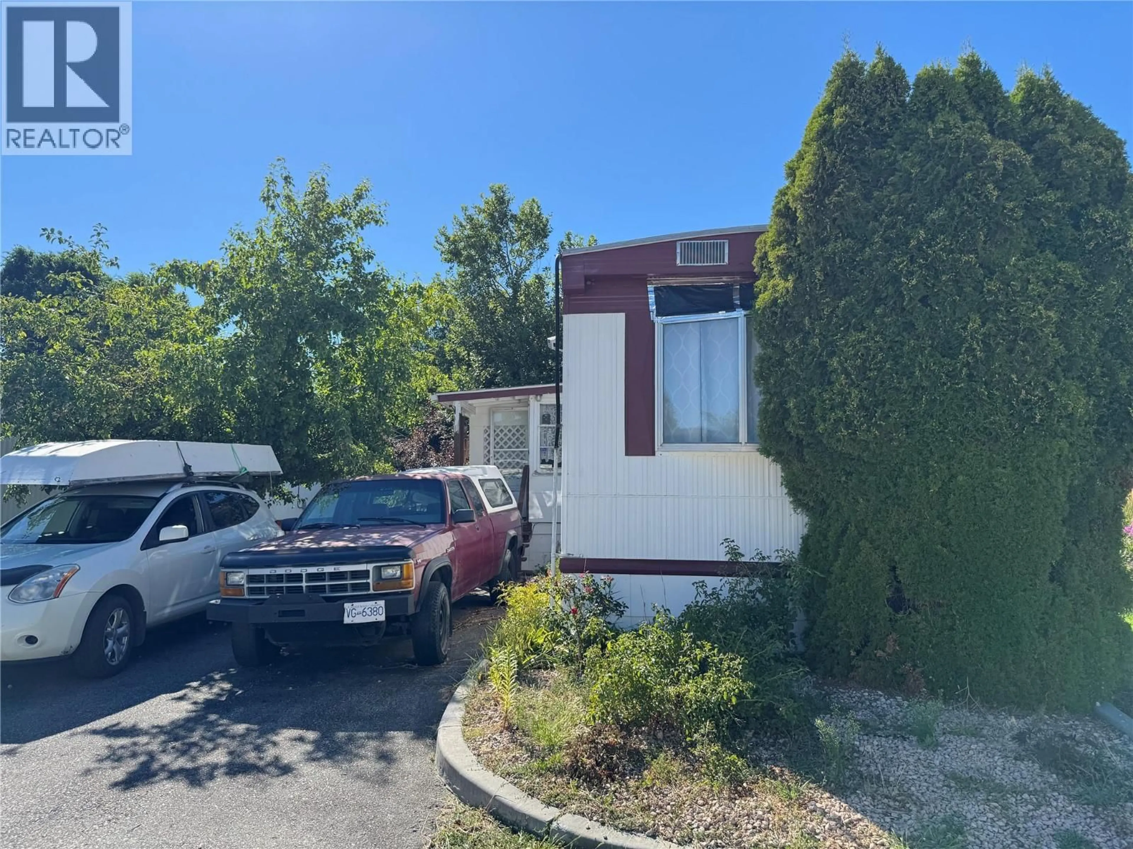 A pic from outside/outdoor area/front of a property/back of a property/a pic from drone, street for 19 - 8712 STEUART STREET, Summerland British Columbia V0H1Z6