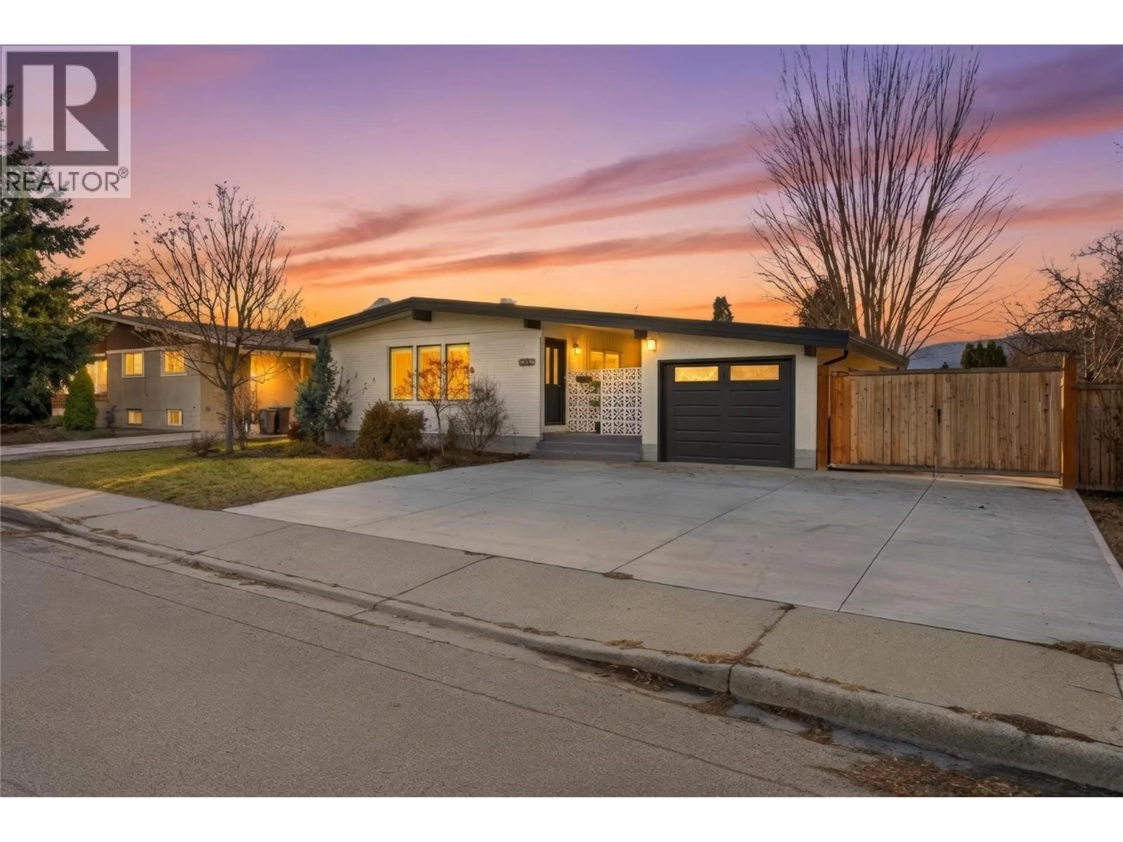 Home with brick exterior material, street for 1497 LOMBARDY SQUARE, Kelowna British Columbia V1Y3S6