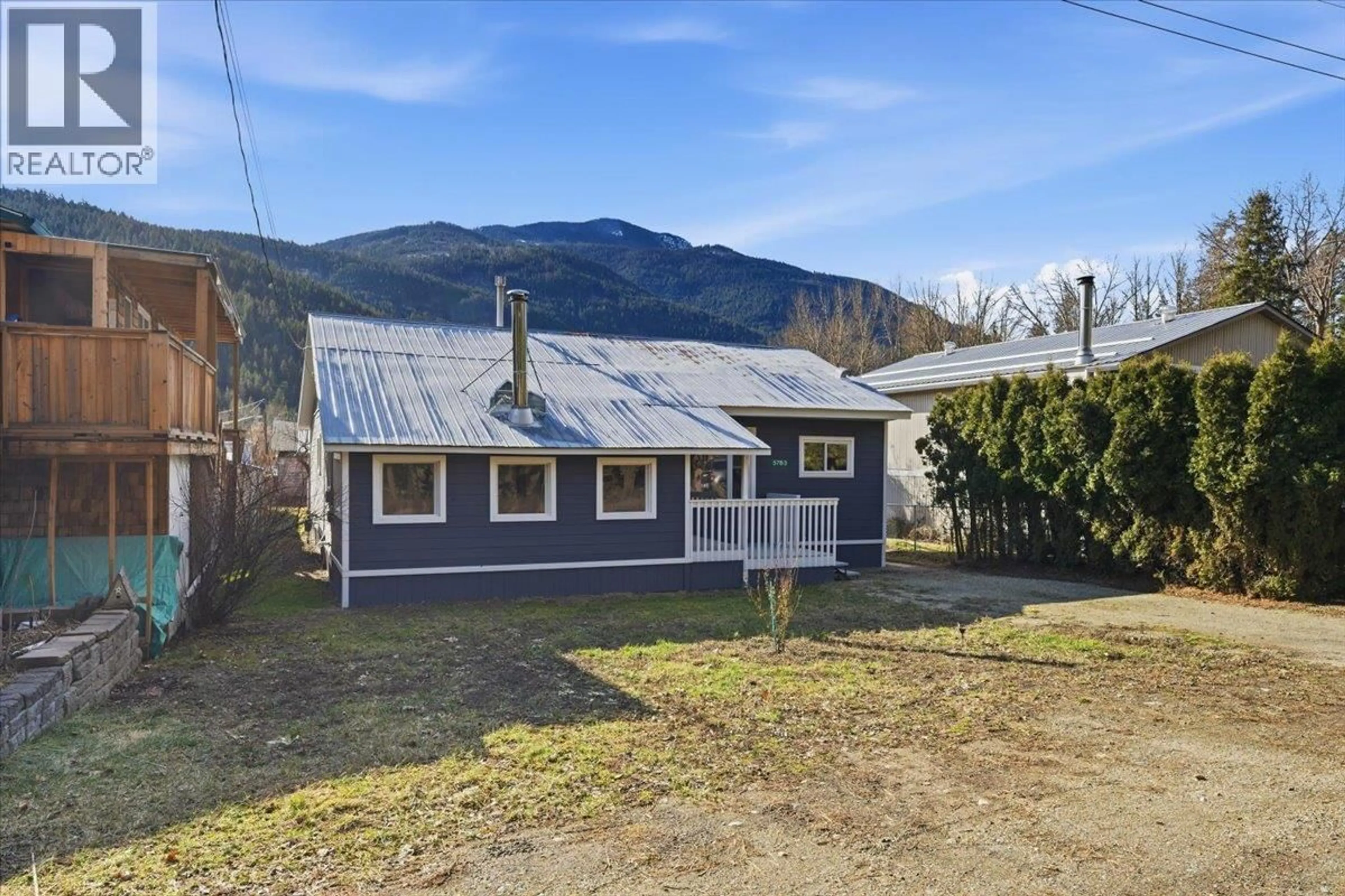 A pic from outside/outdoor area/front of a property/back of a property/a pic from drone, mountain view for 5783 TUKTAKAMIN ROAD, Falkland British Columbia V0E1W0